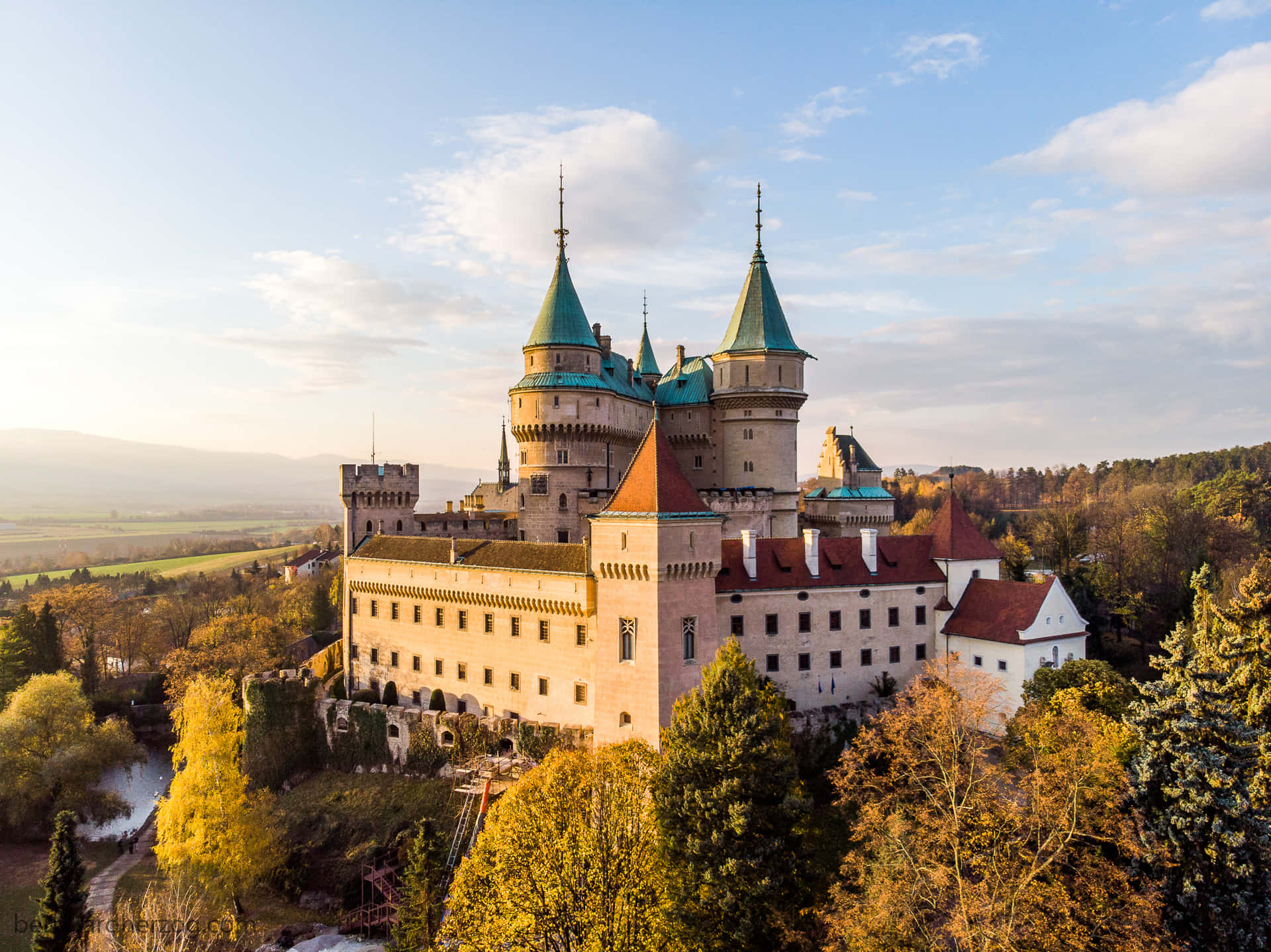 Bojnice Castle From The Forest Background
