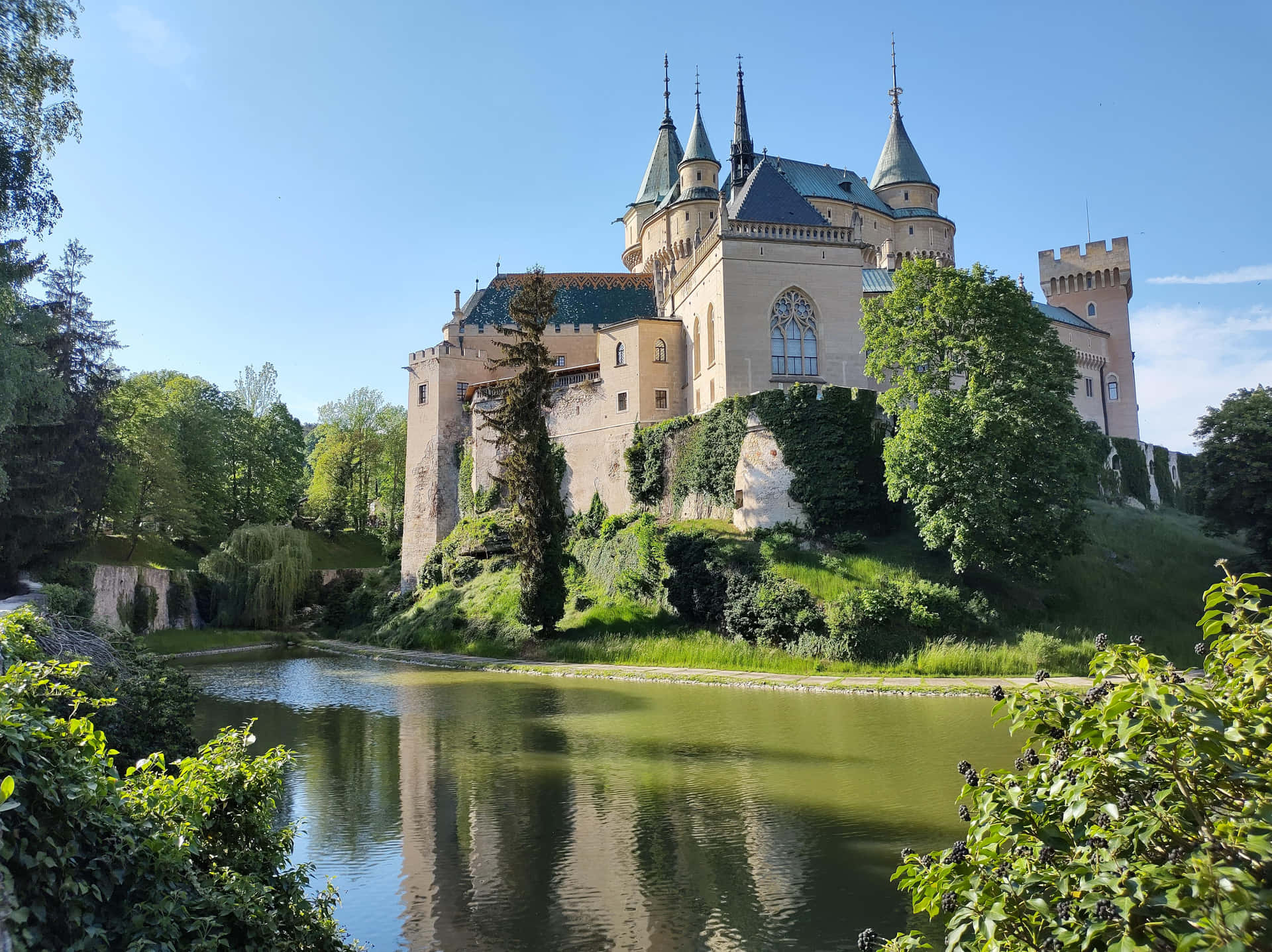 Bojnice Castle Standing Atop The Grass