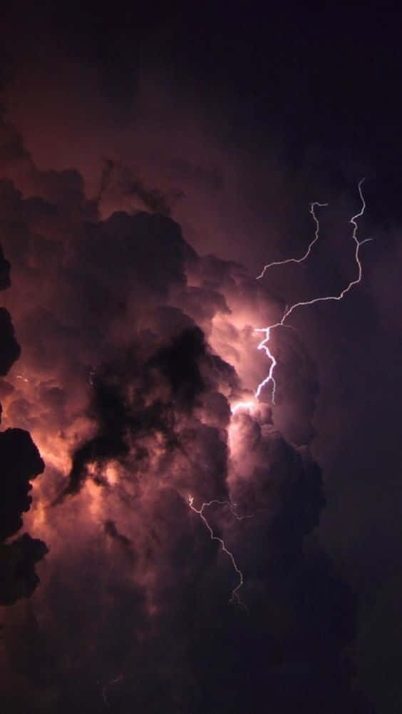 Bolts Of Lightning Illuminate The Night Sky Background