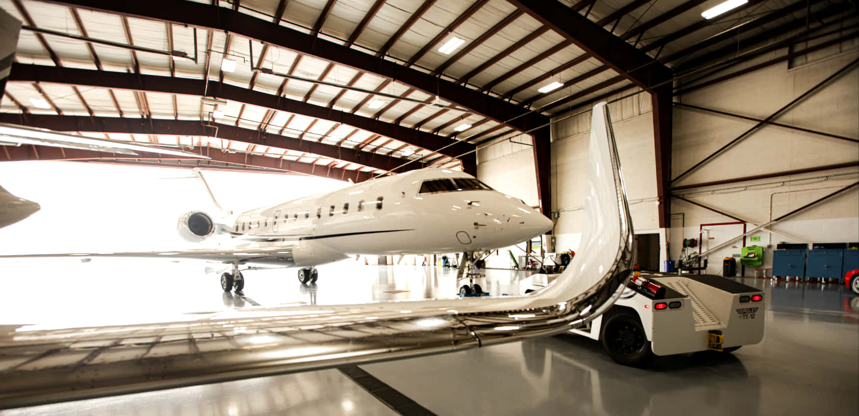 Bombardier Global Express Small Airplane On Hangar Background