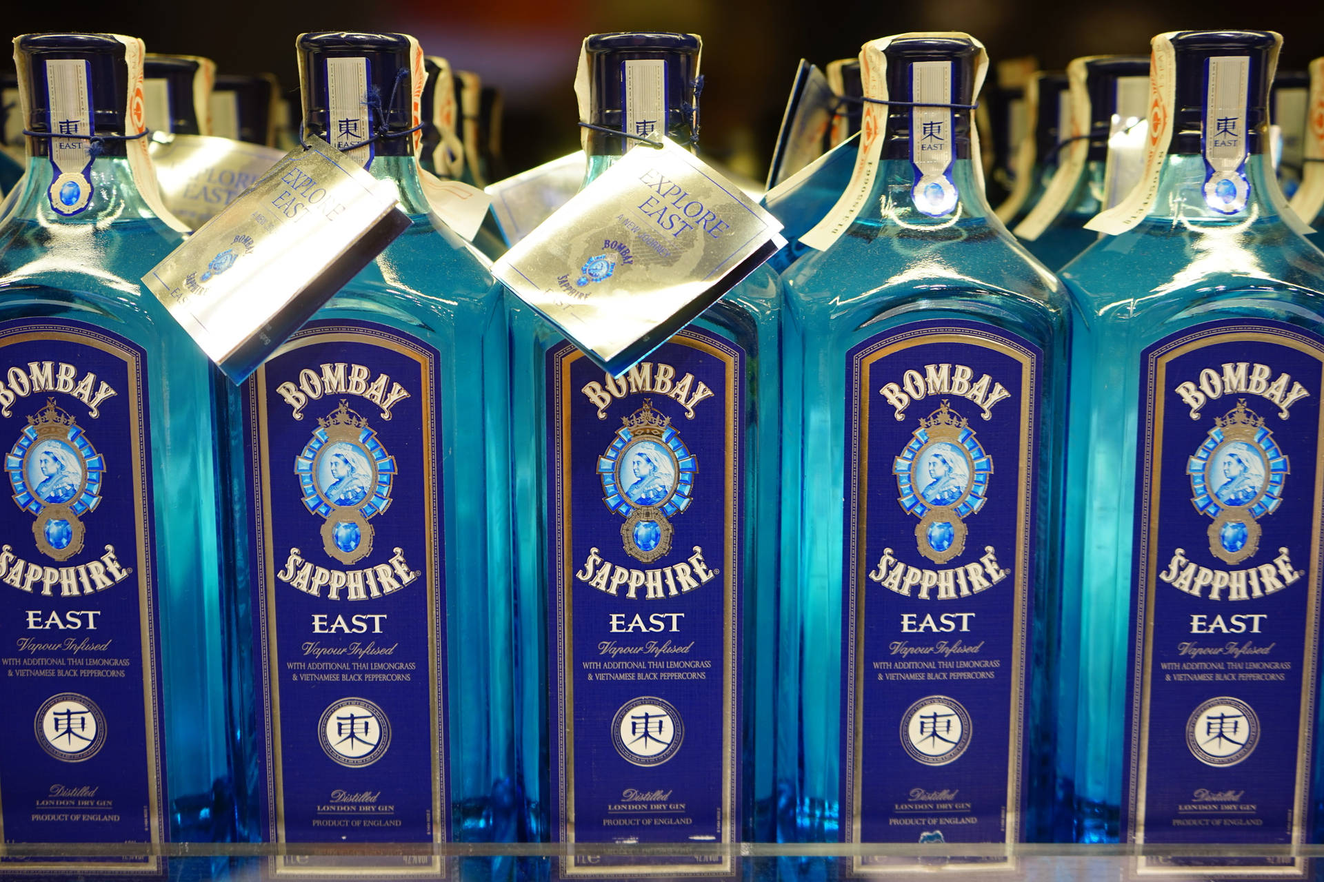 Bombay Bottles On Store Rack Background