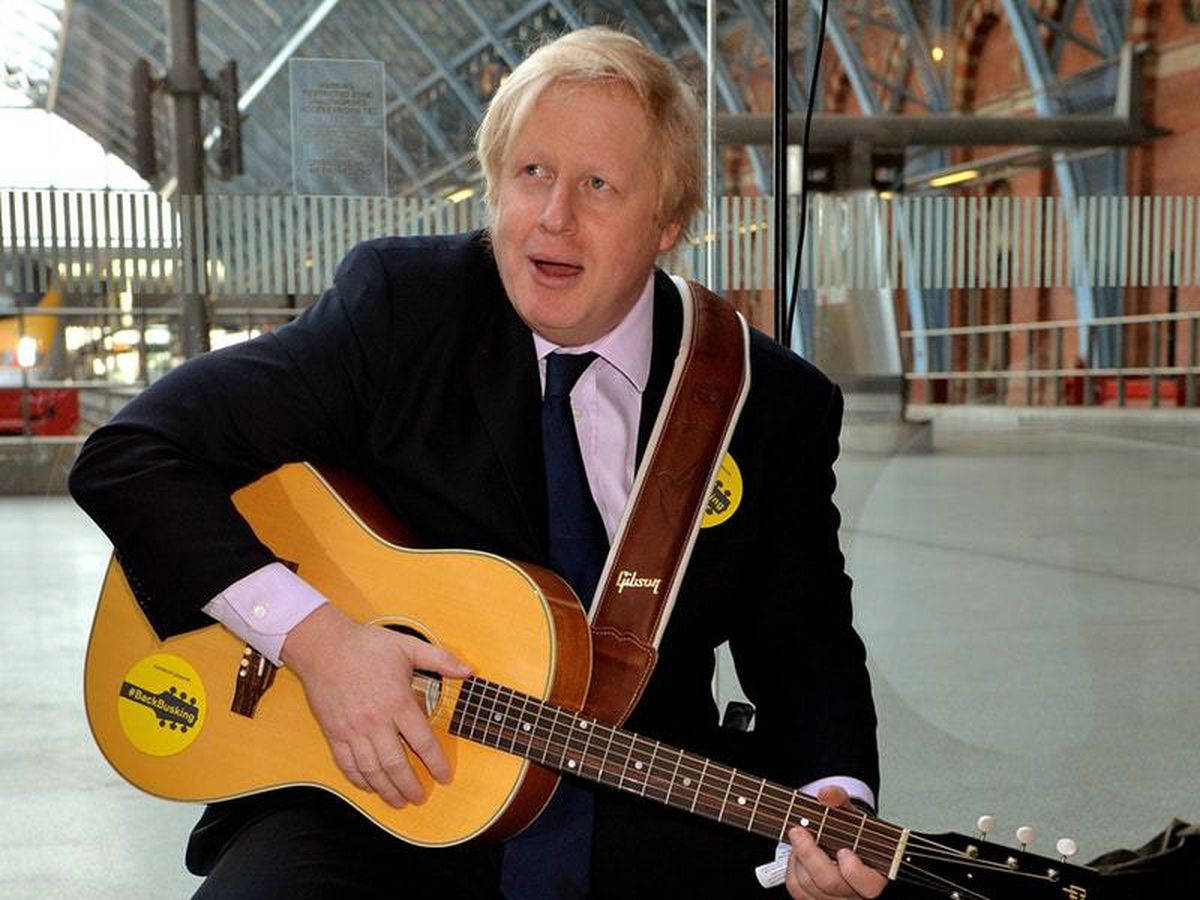 Boris Johnson Playing A Guitar Background