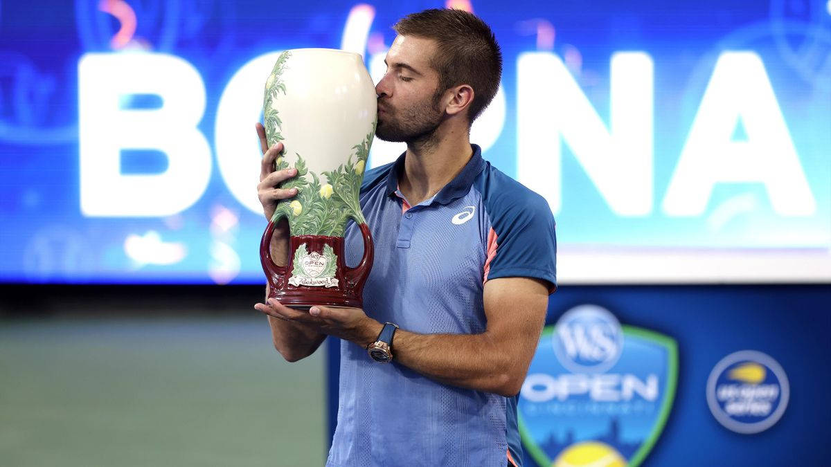 Borna Coric Kissing Trophy Background