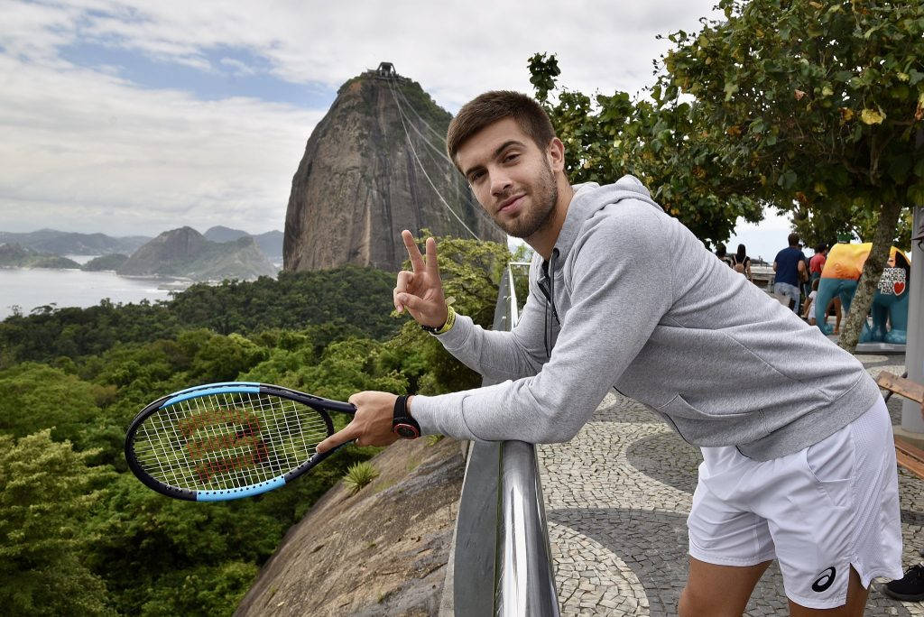 Borna Coric V Sign Background