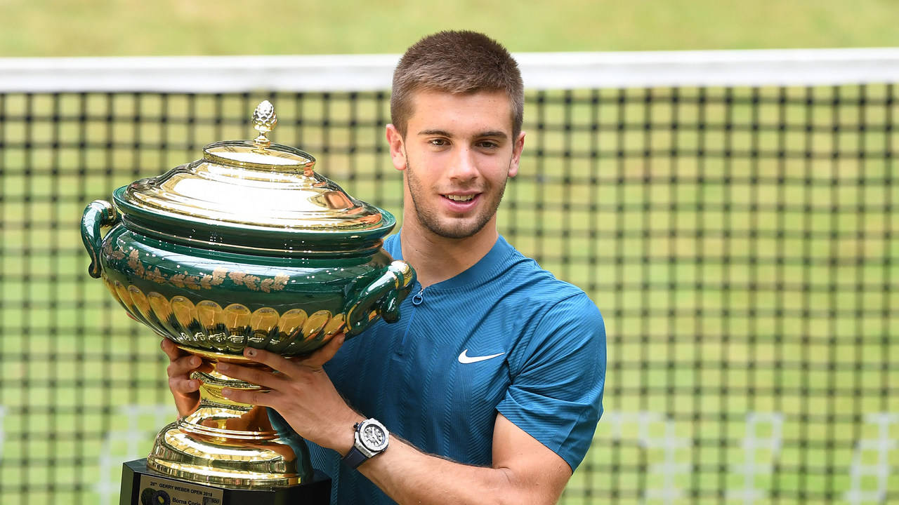 Borna Coric With Trophy Background
