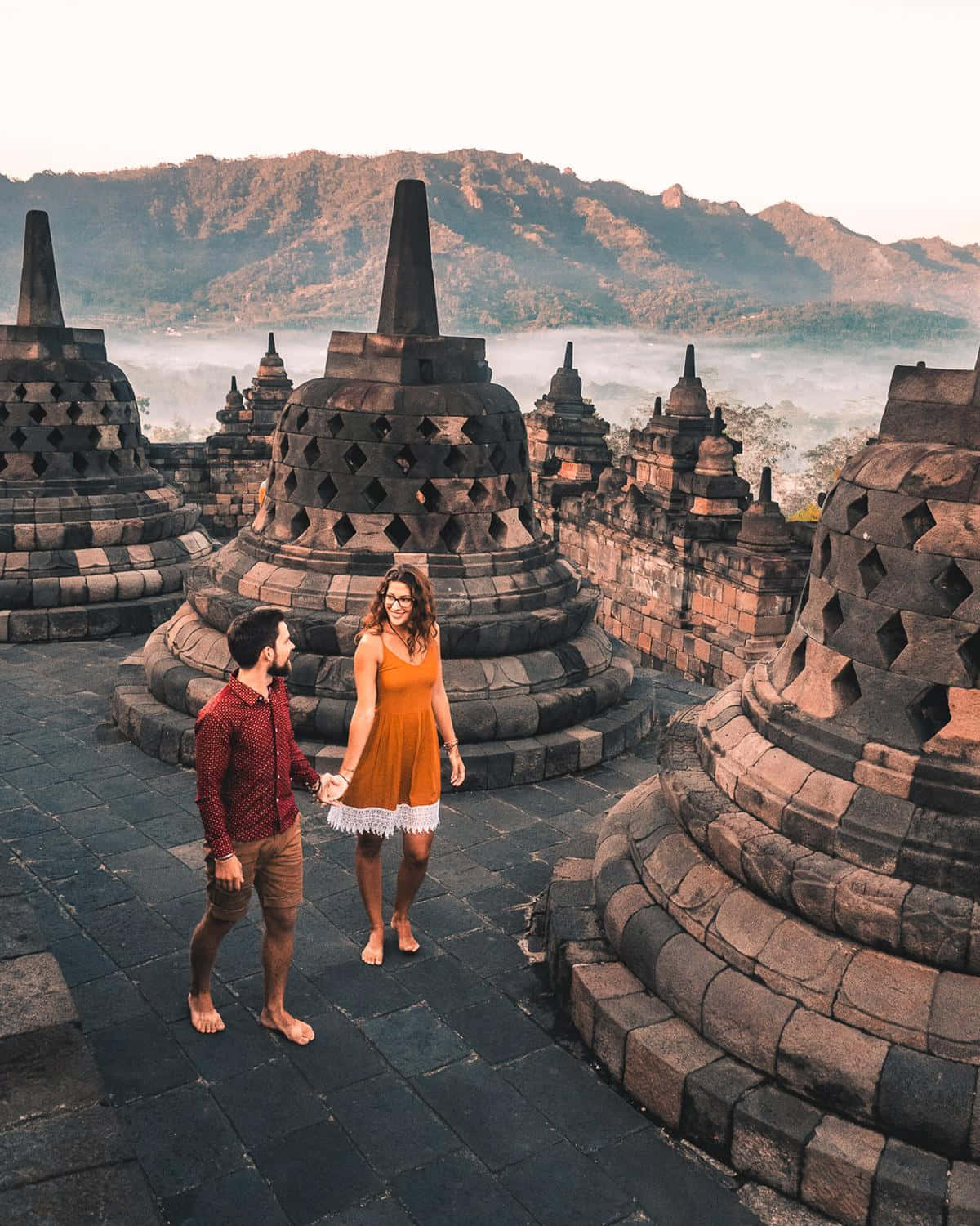 Borobudur Temple Couple Holding Hands Background