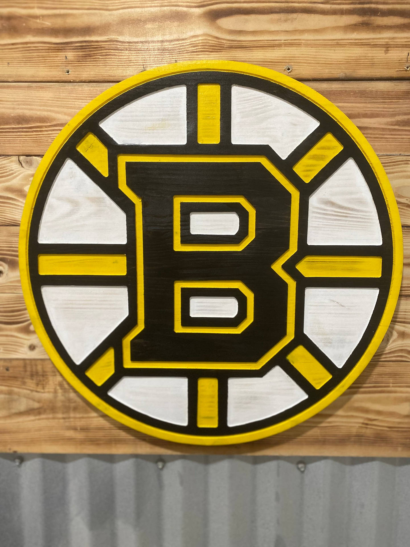 Boston Bruins Logo On Wooden Wall Background