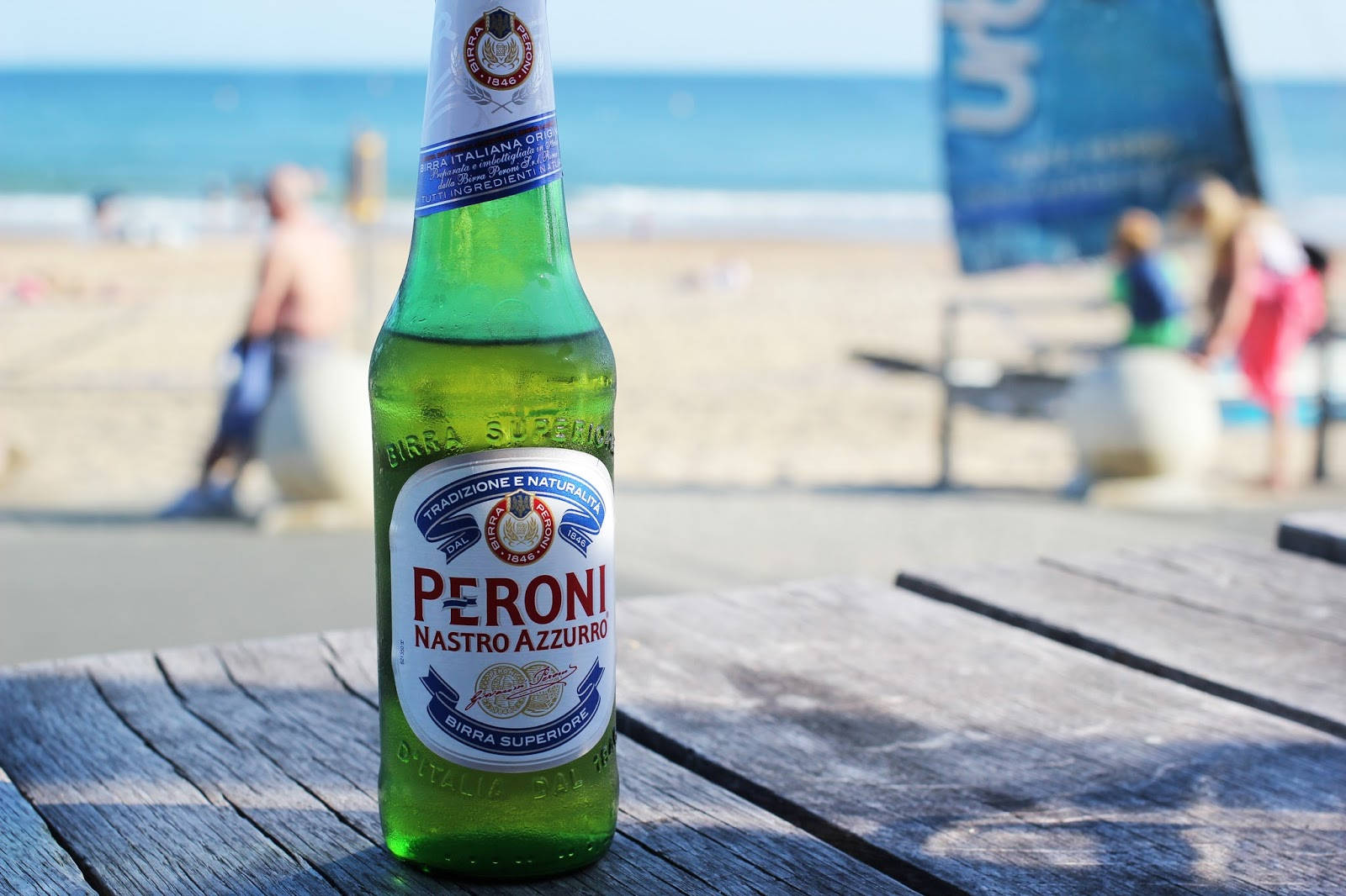 Bottle Of Peroni Beer On A Wooden Plank Background