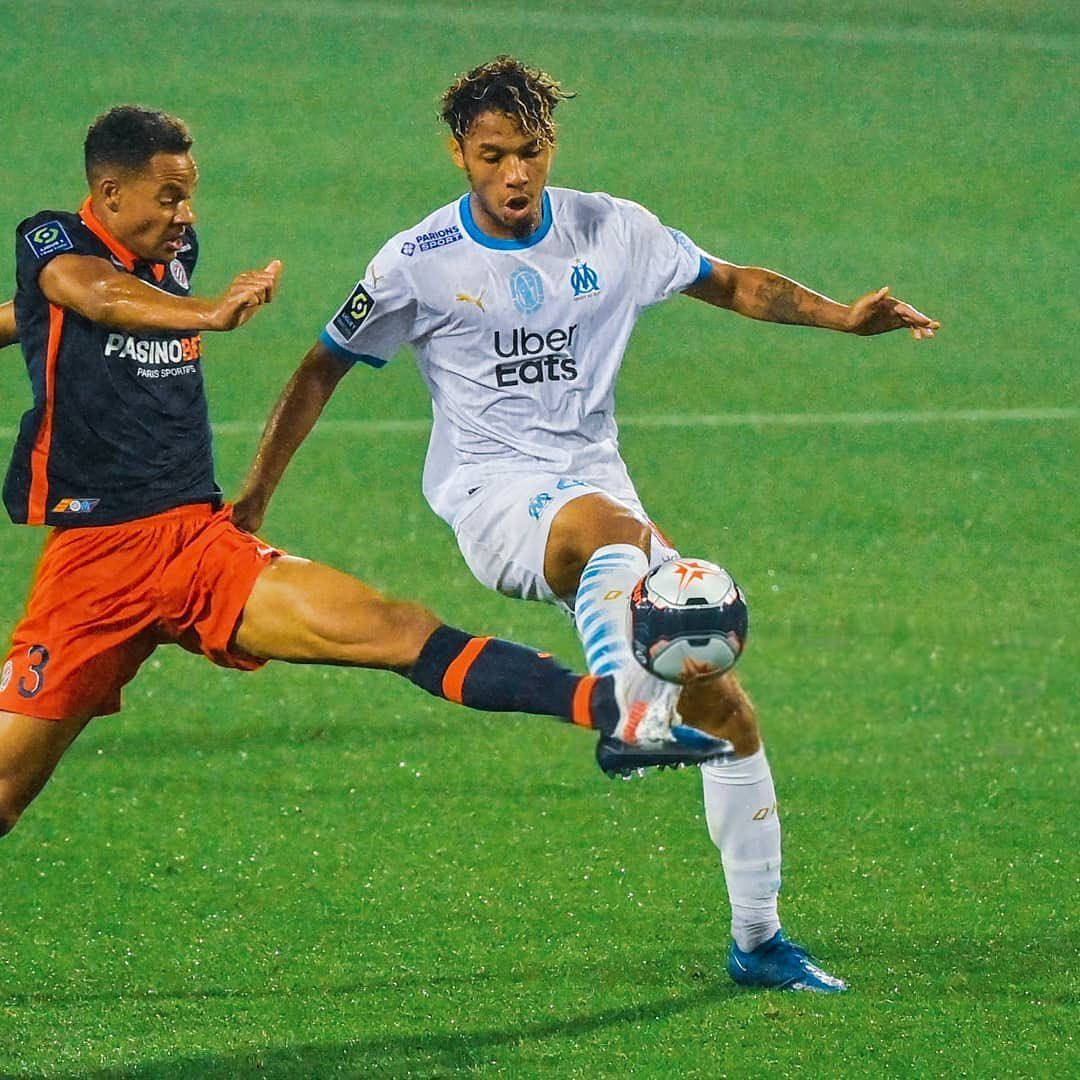 Boubacar Kamara And Opponent Kicking The Ball Background