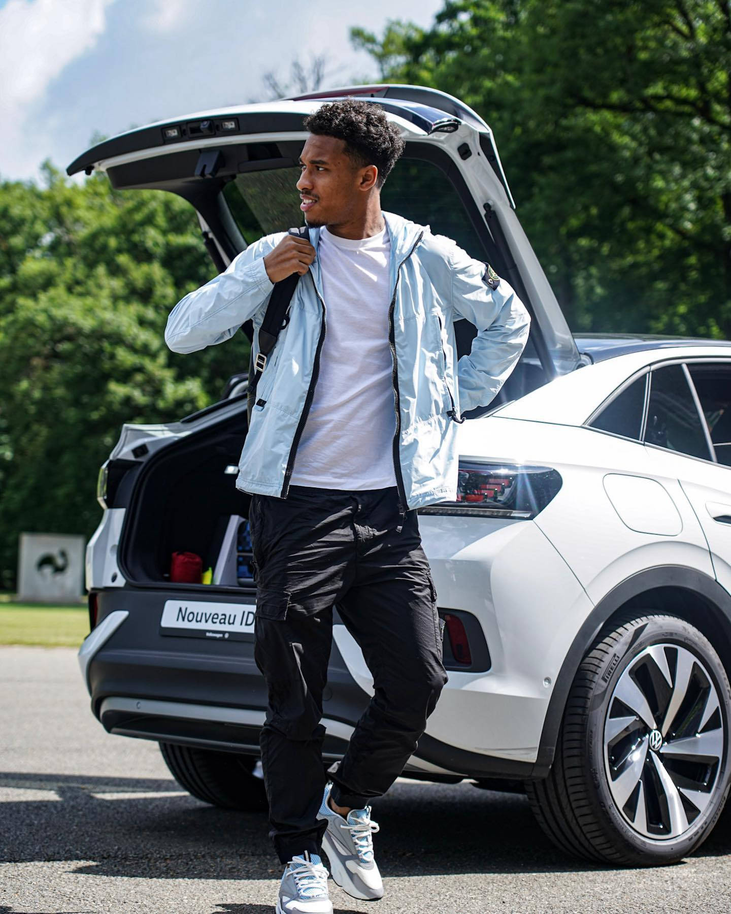 Boubacar Kamara Beside A Car Background