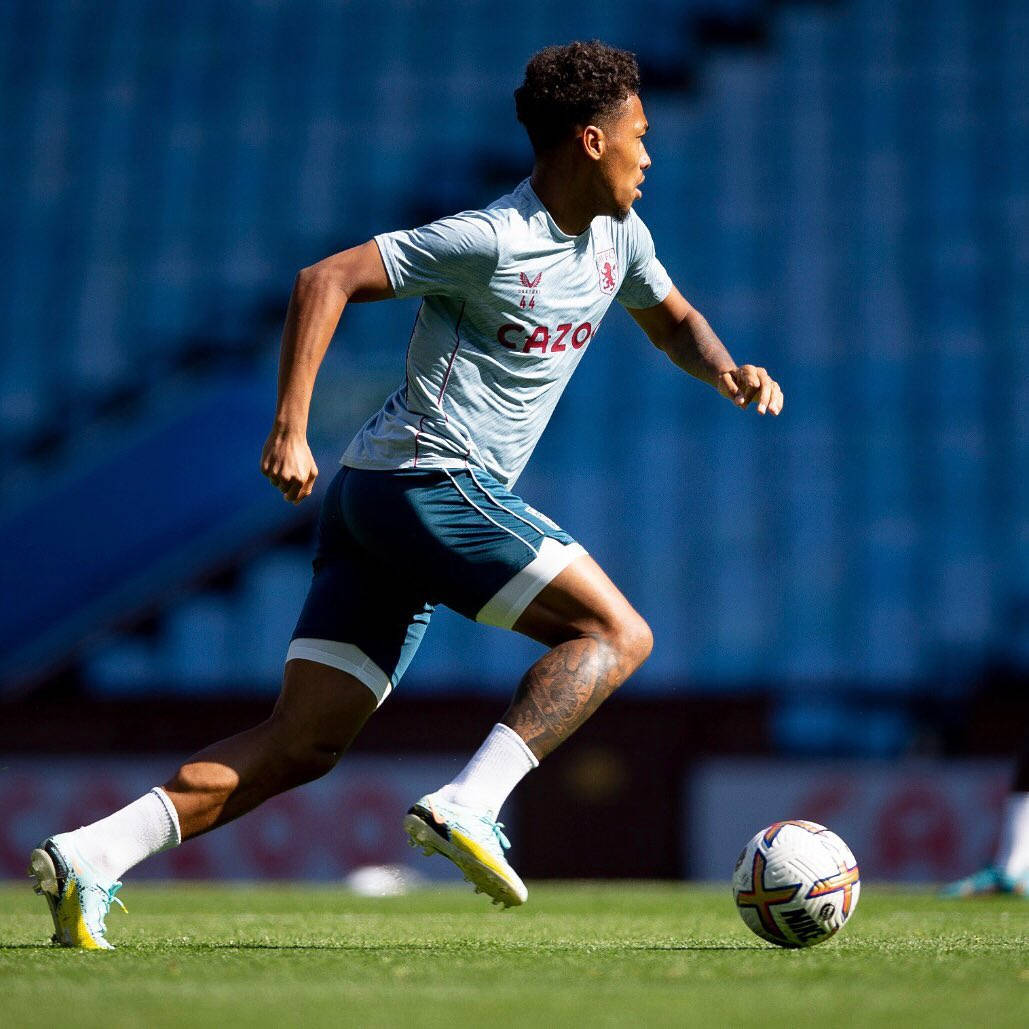 Boubacar Kamara Dashing Across Field Background