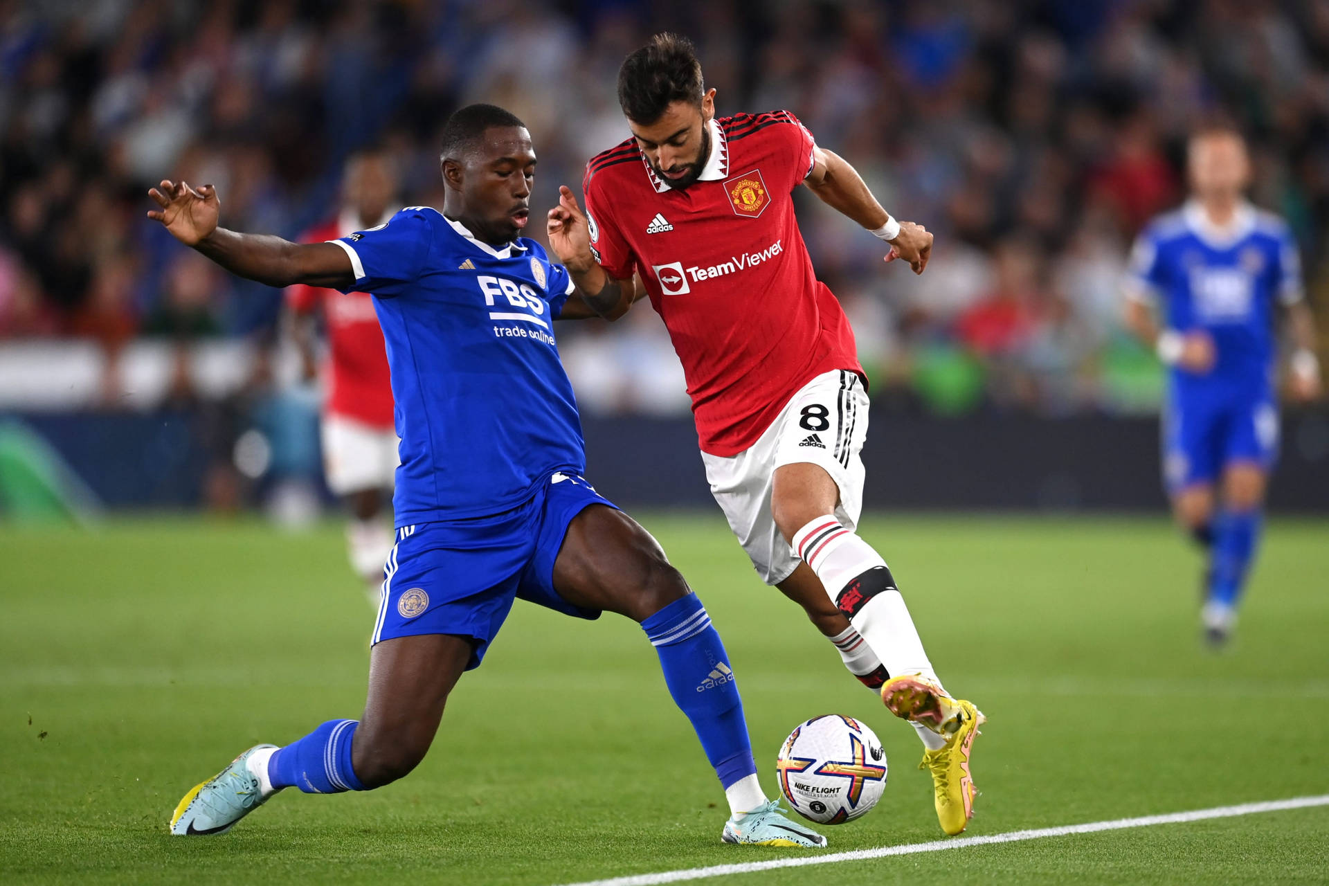 Boubakary Soumaré Showcasing His Football Prowess Against An Opponent Background