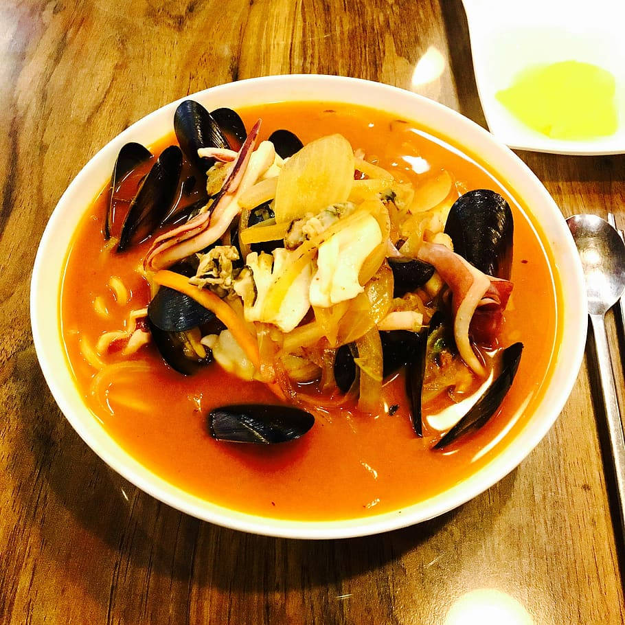 Bouillabaisse Seafood Noodle Soup In A Bowl Background