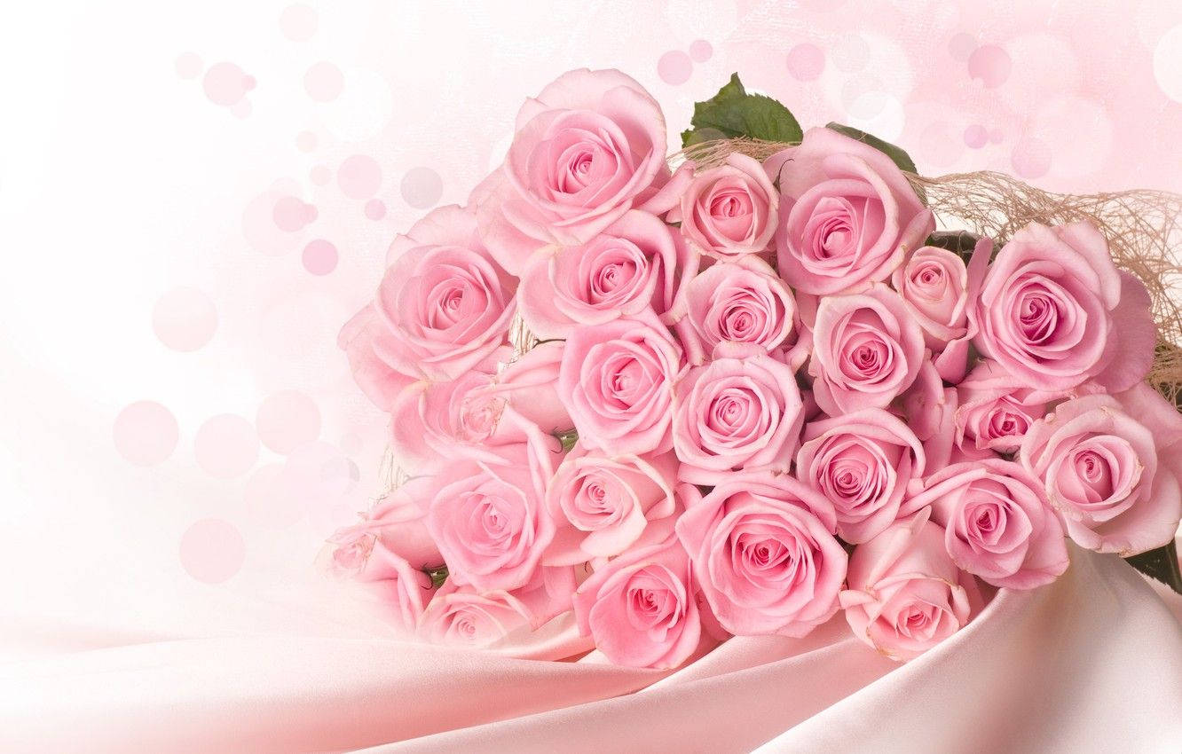 Bouquet Of Roses On Pink Satin Background