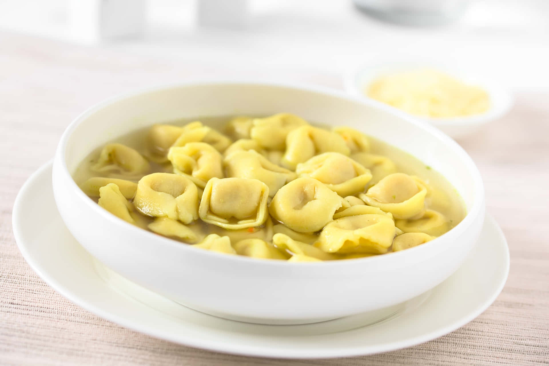 Bowl Full Of Tortellini In Brodo Background