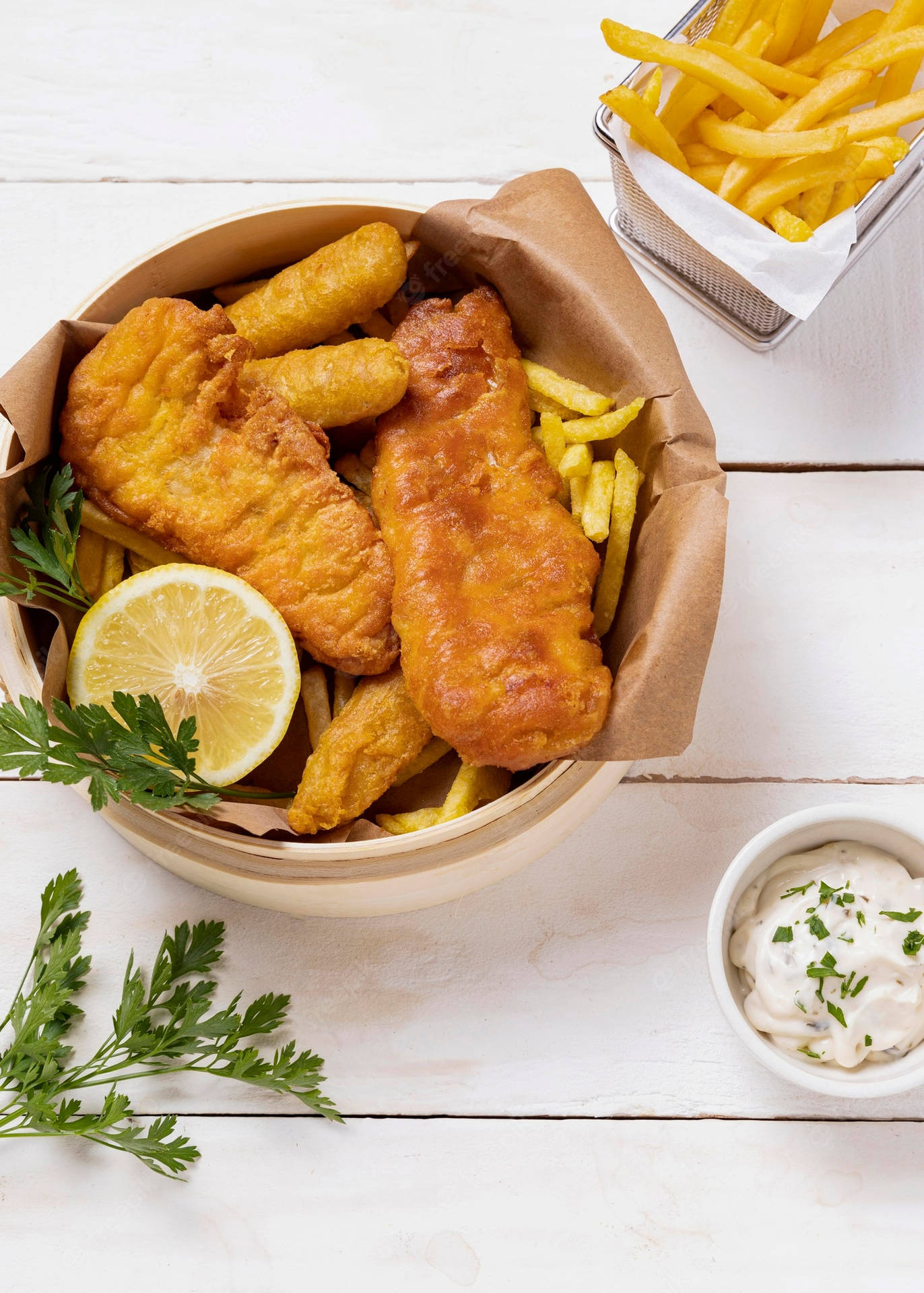 Bowl Of Fish And Chips On A White Table