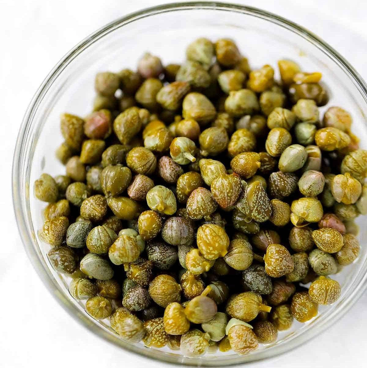 Bowl Of Green Caper Buds Background