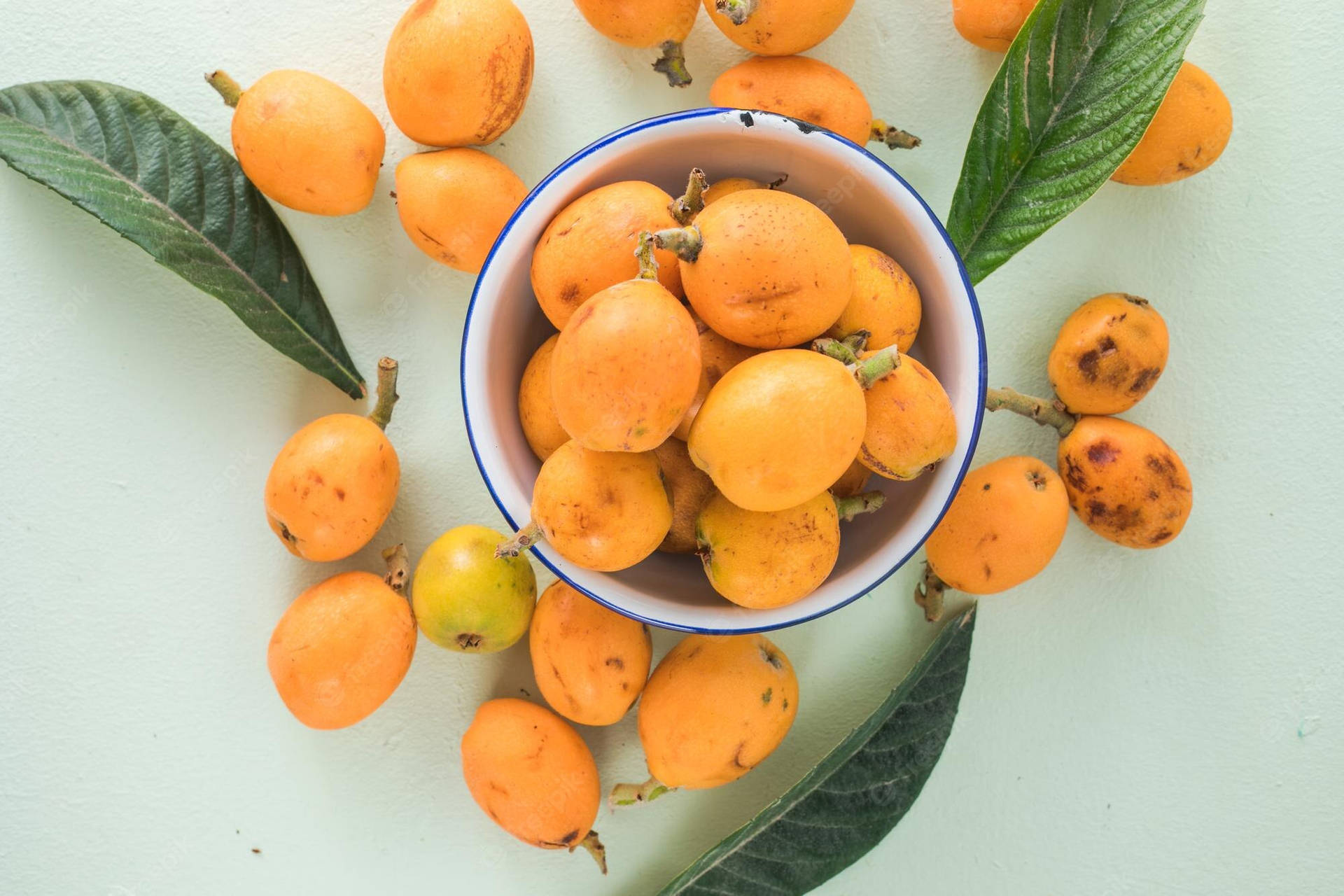 Bowl Of Loquat Fruits Background