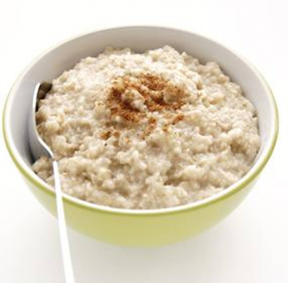 Bowl Of Oatmeal With Cinnamon Background