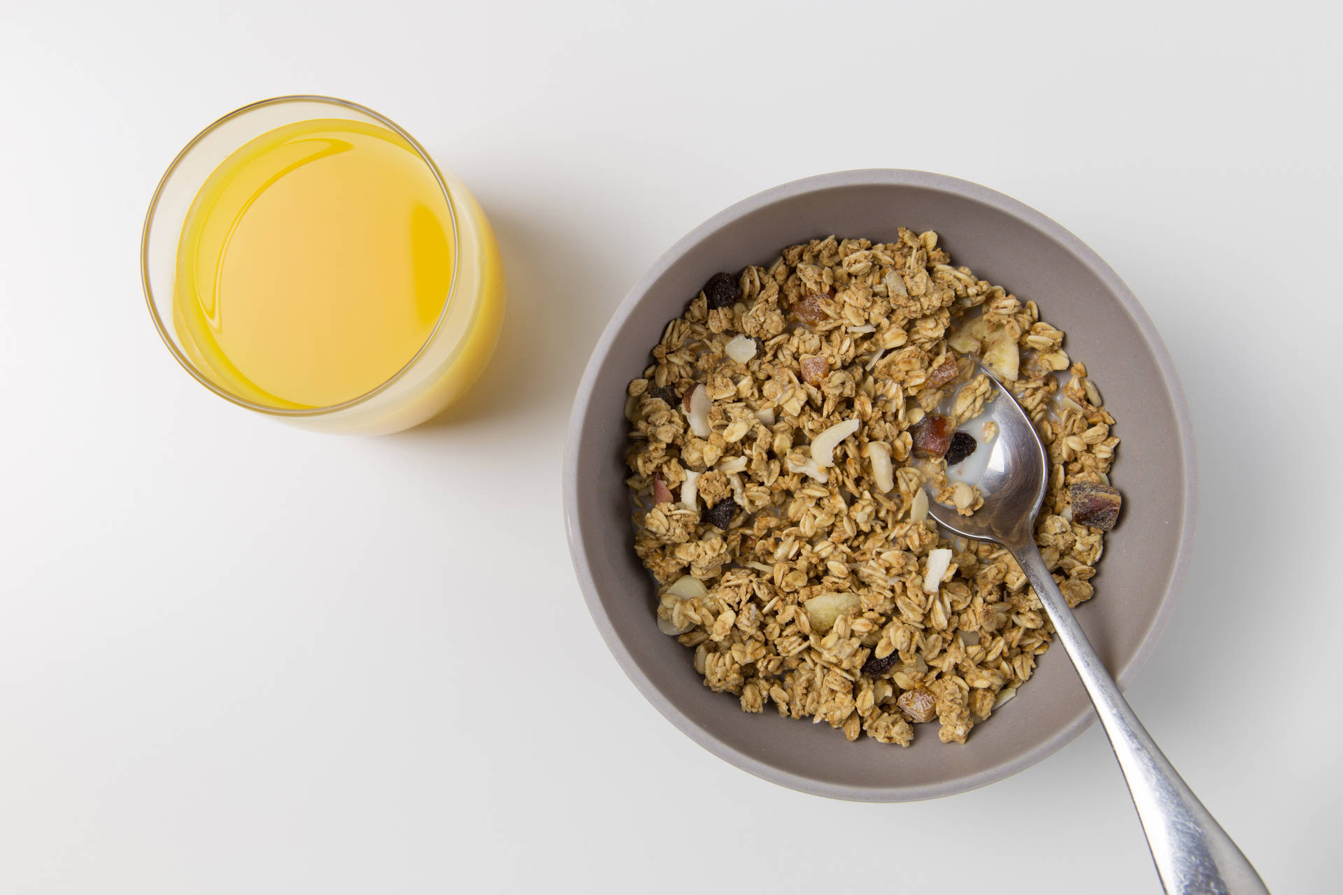 Bowl Of Oatmeal With Orange Juice Background