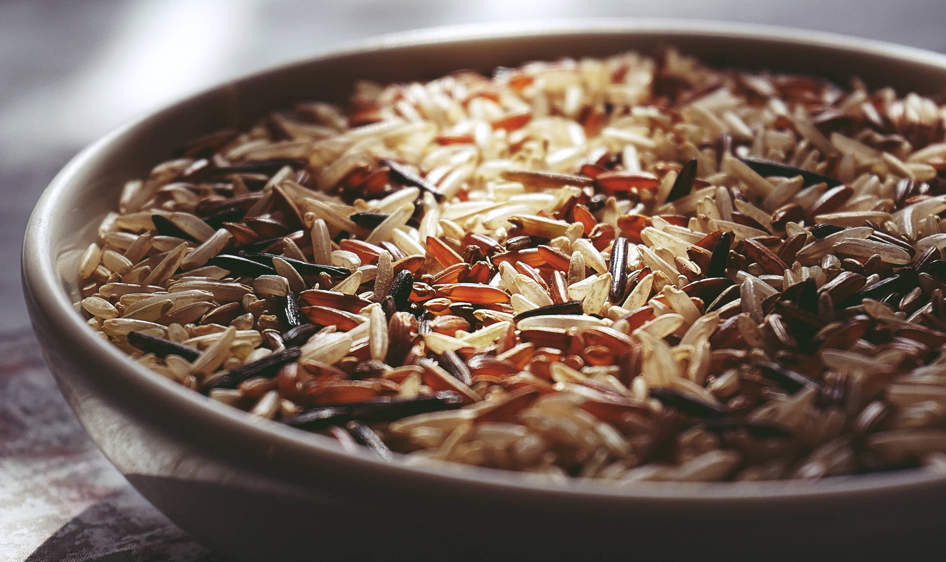 Bowl Of Raw Red Rice Background