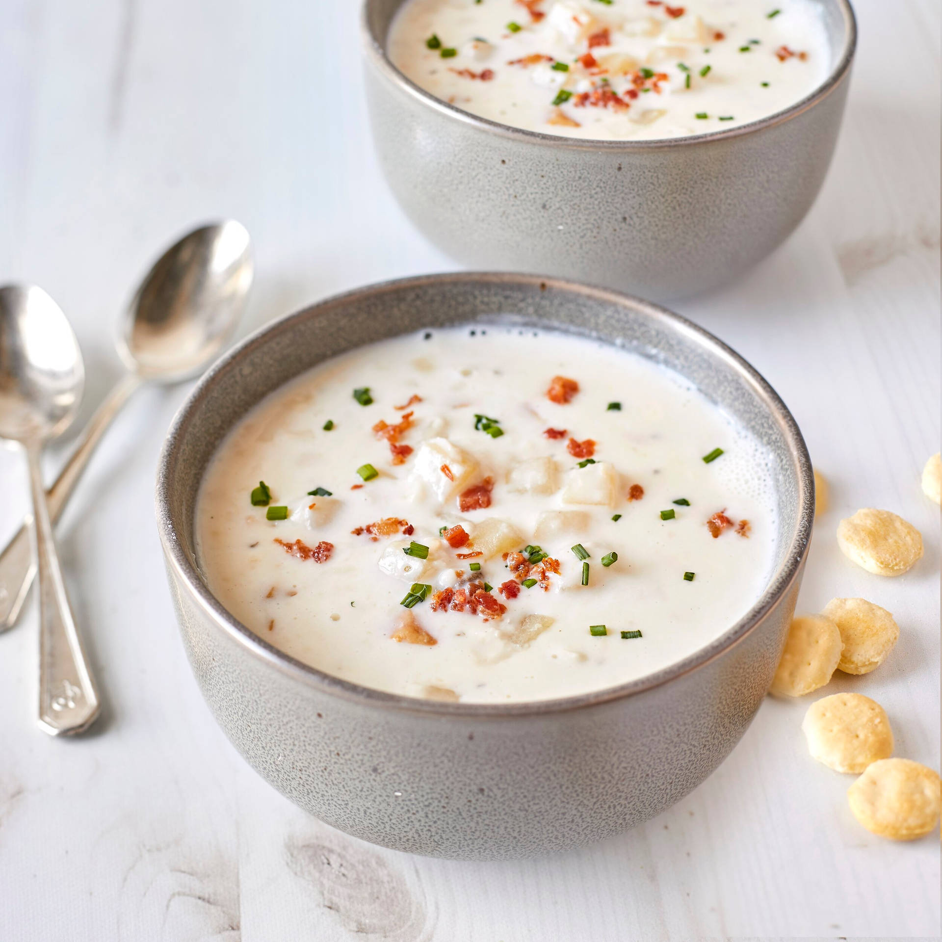 Bowls Of New England Clam Chowder And Crackers Background