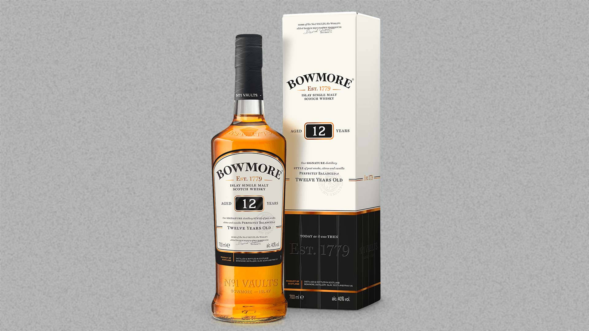 Bowmore 12 Years Old Scotch Whisky Bottle And Glass Background