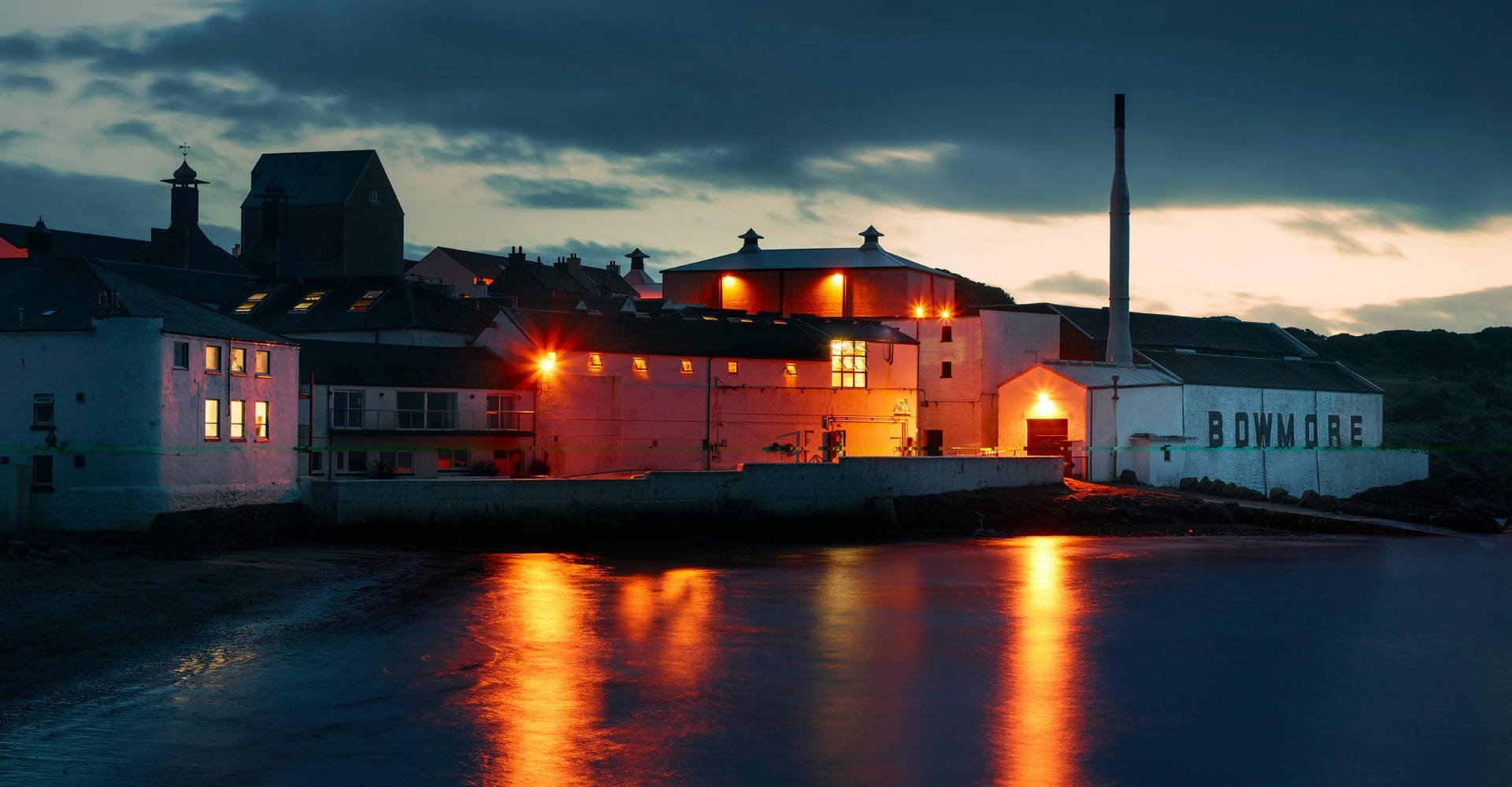 Bowmore Distillery Night In Isle Of Islay Background