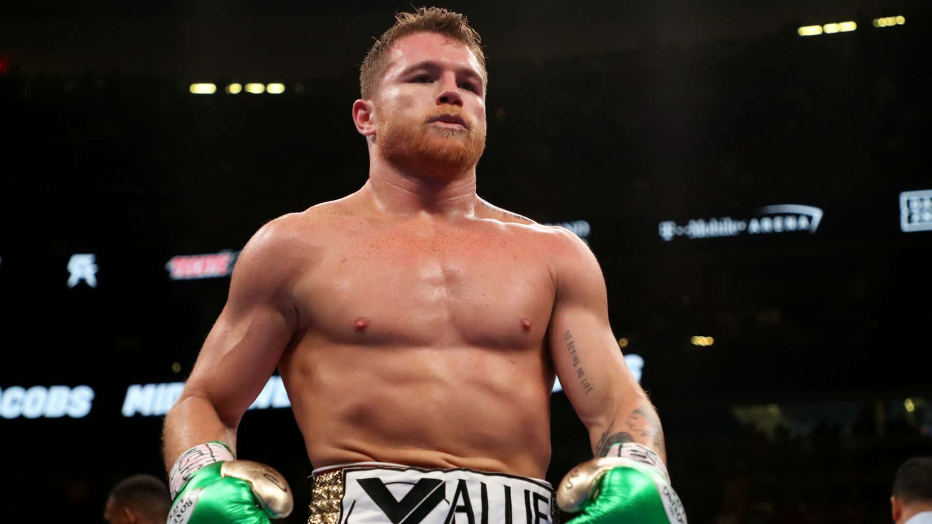 Boxing Champion Canelo Alvarez In Mid-fight Punch Background