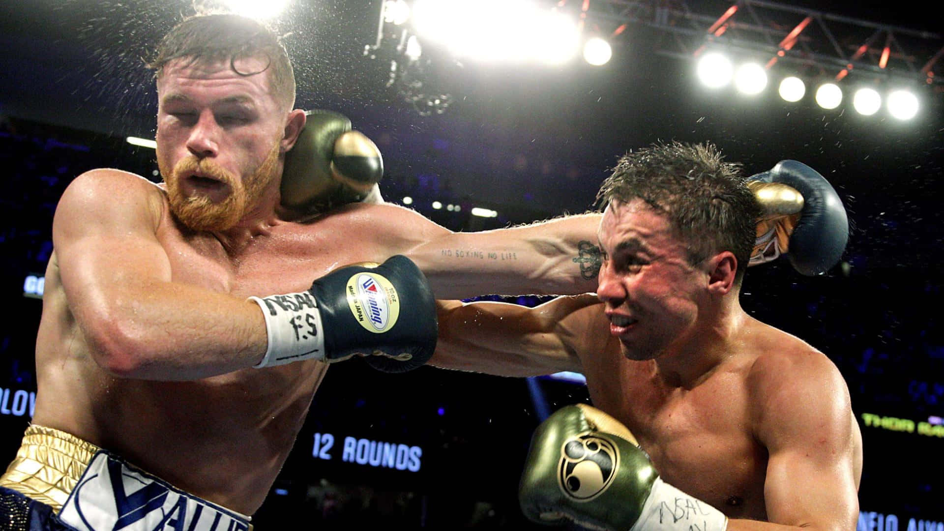 Boxing Champion Saul 'canelo' Alvarez In Action Background