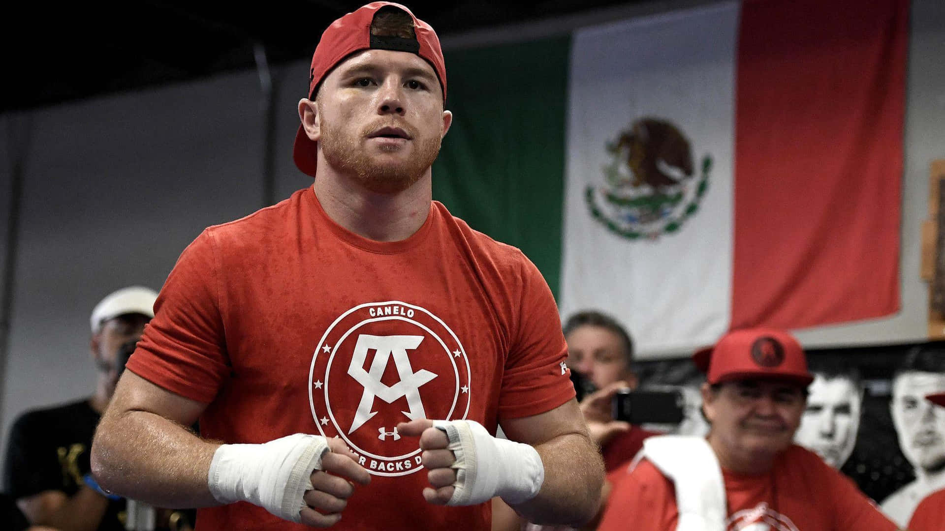 Boxing Champion Saul Canelo Alvarez In Red Outfit Background