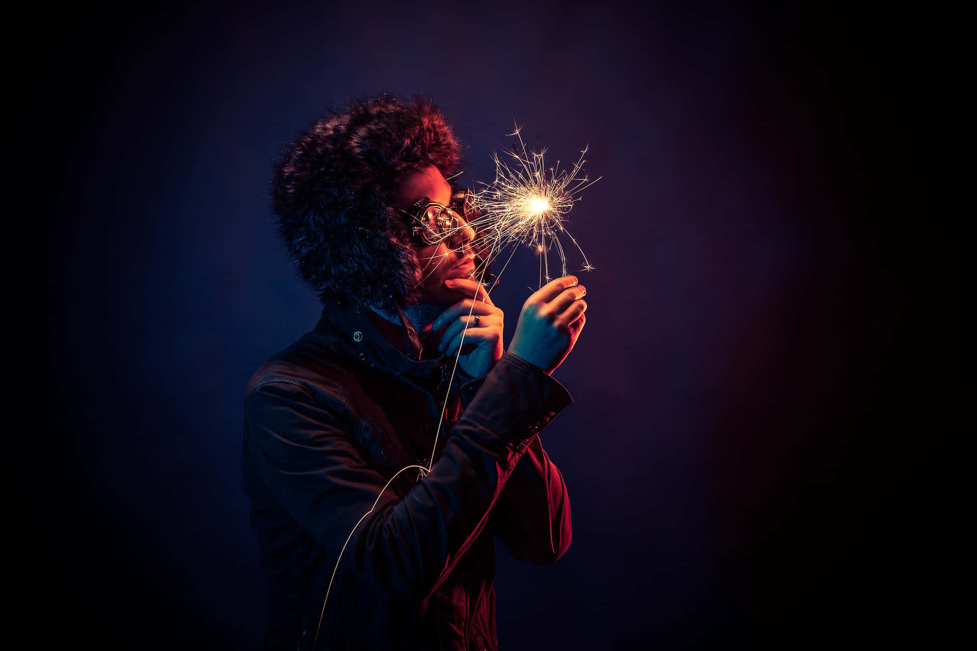 Boy Intrigued The Spark Fire Background