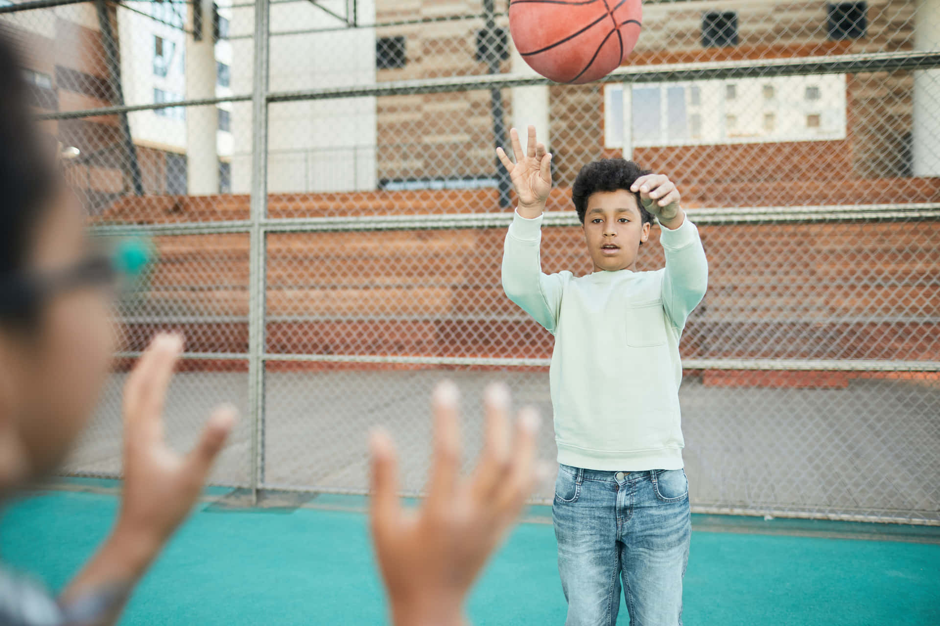 Boy Passing A Basketball Background