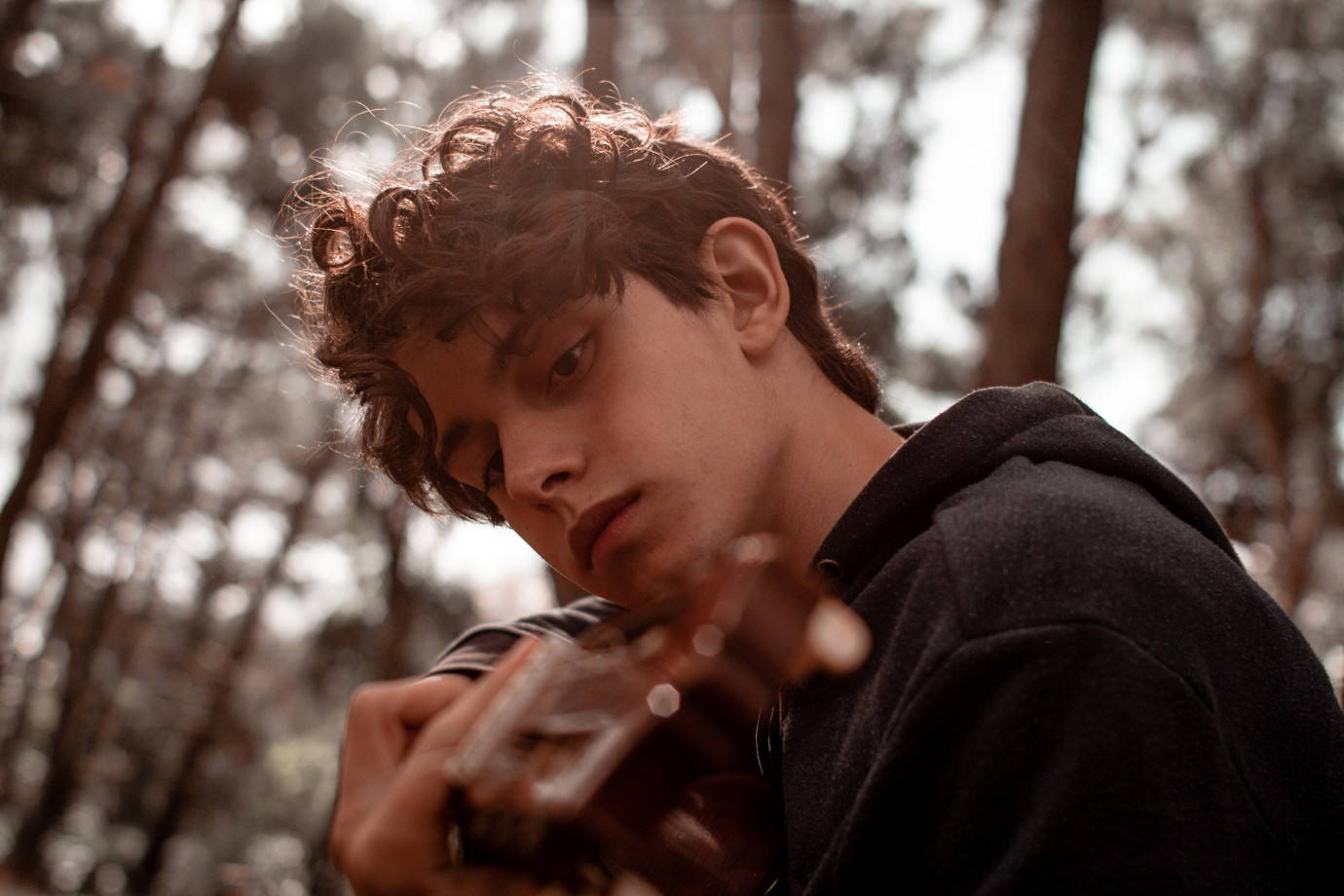 Boy Playing Guitar From Sublime Movie Background