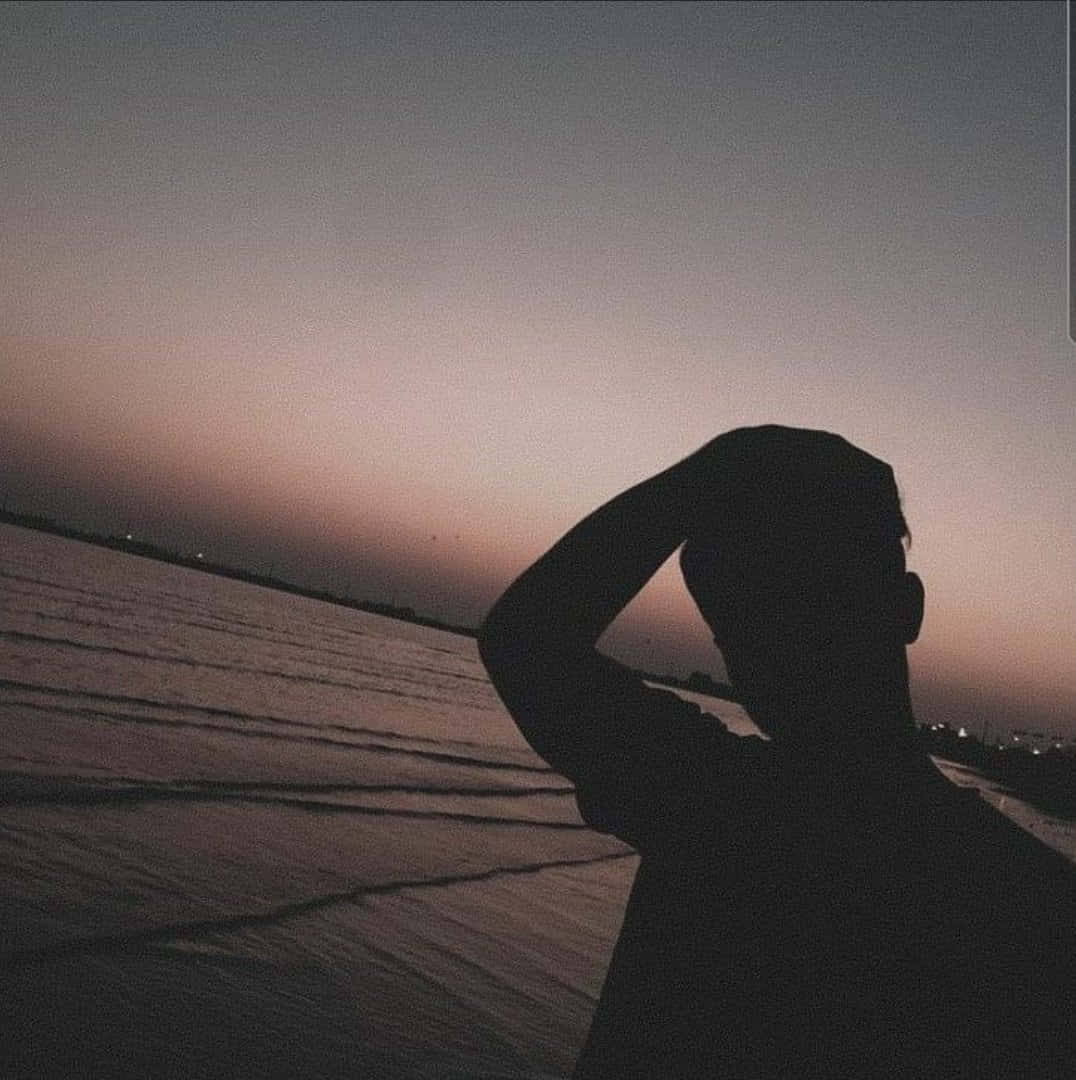 Boy Shadow Pfp On The Beach Background