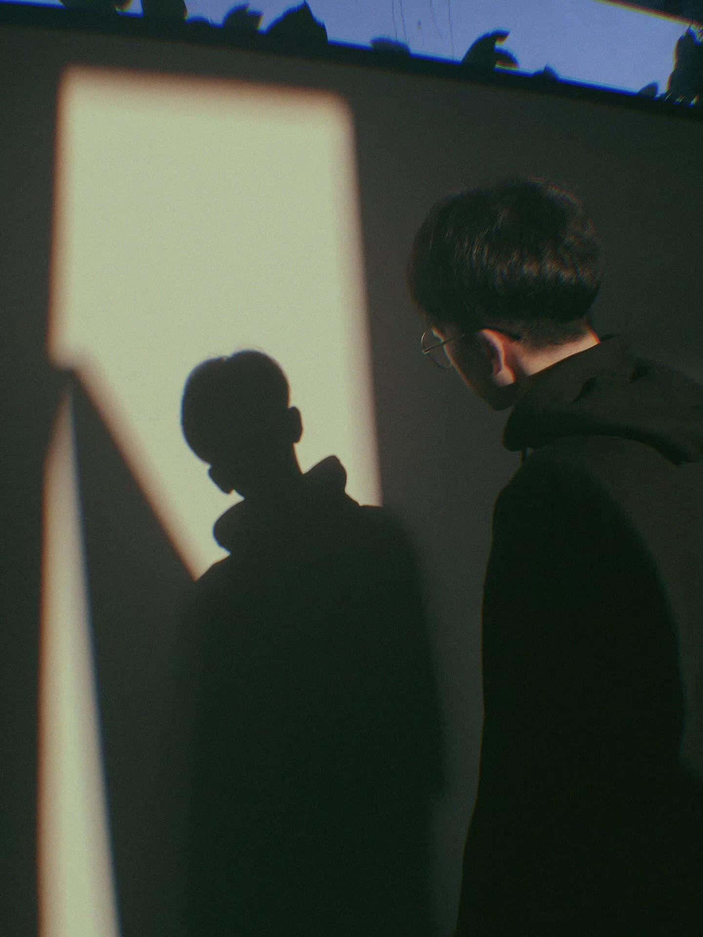 Boy Staring At Shadow Pfp Background