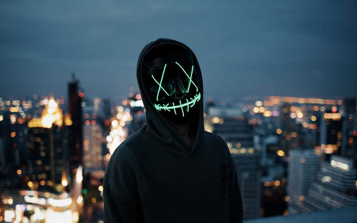Boy With 4k Mask Overlooking City Lights