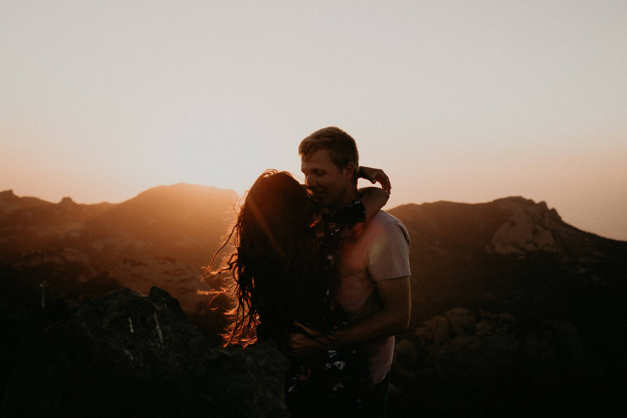 Boyfriend And Girlfriend Hugging And Mountains Background