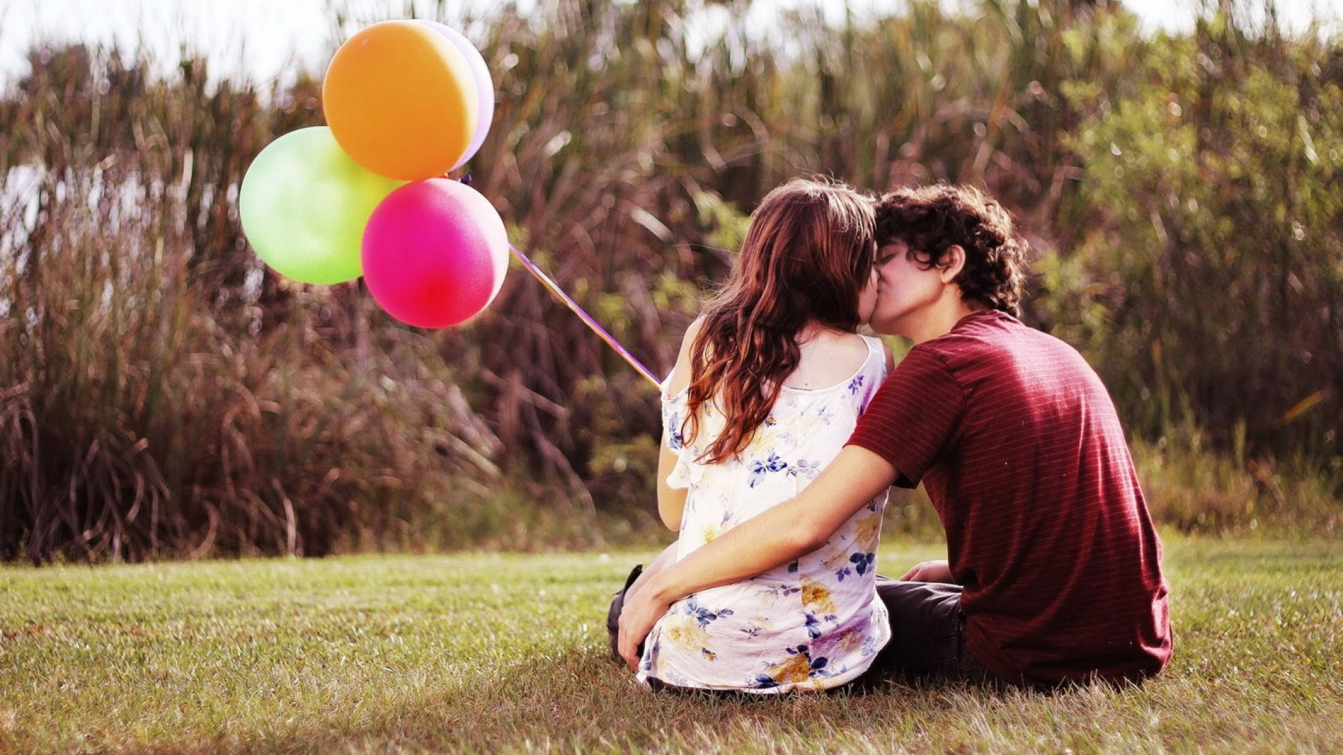 Boyfriend And Girlfriend Kisses And Balloons