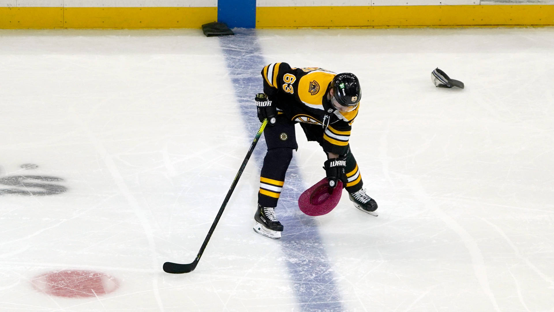 Brad Marchand Removing His Hat Off The Ice