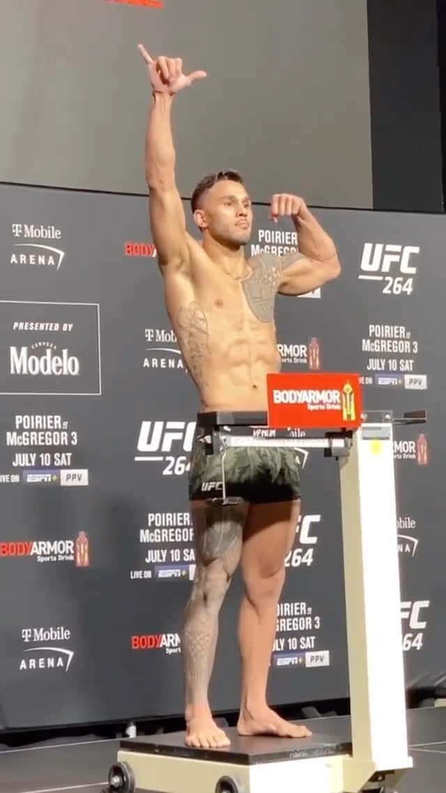 Brad Tavares Flexing And Posing On Scale