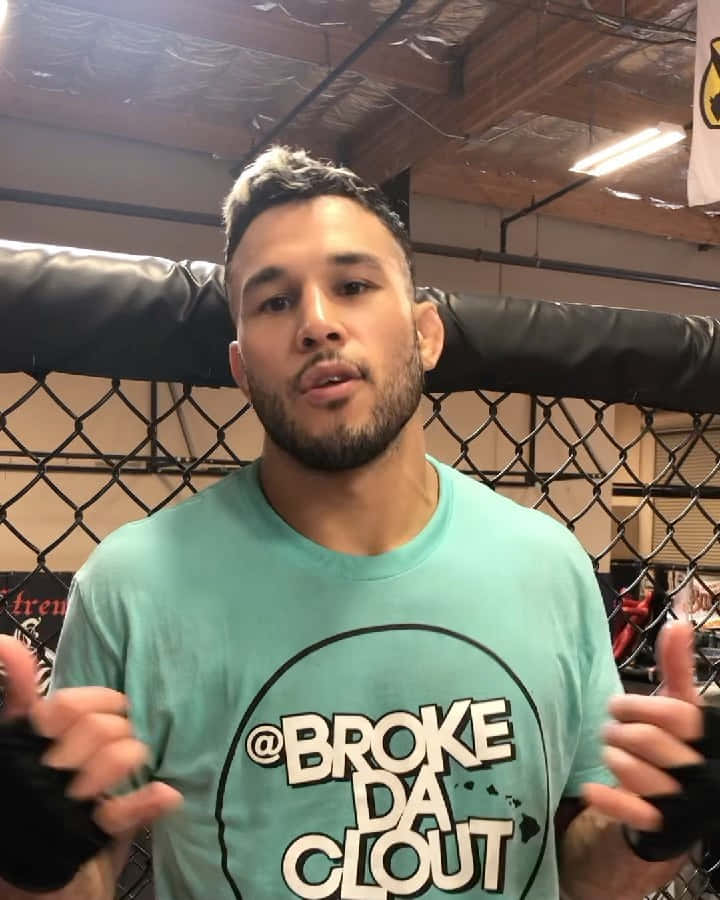 Brad Tavares In A Cyan Shirt