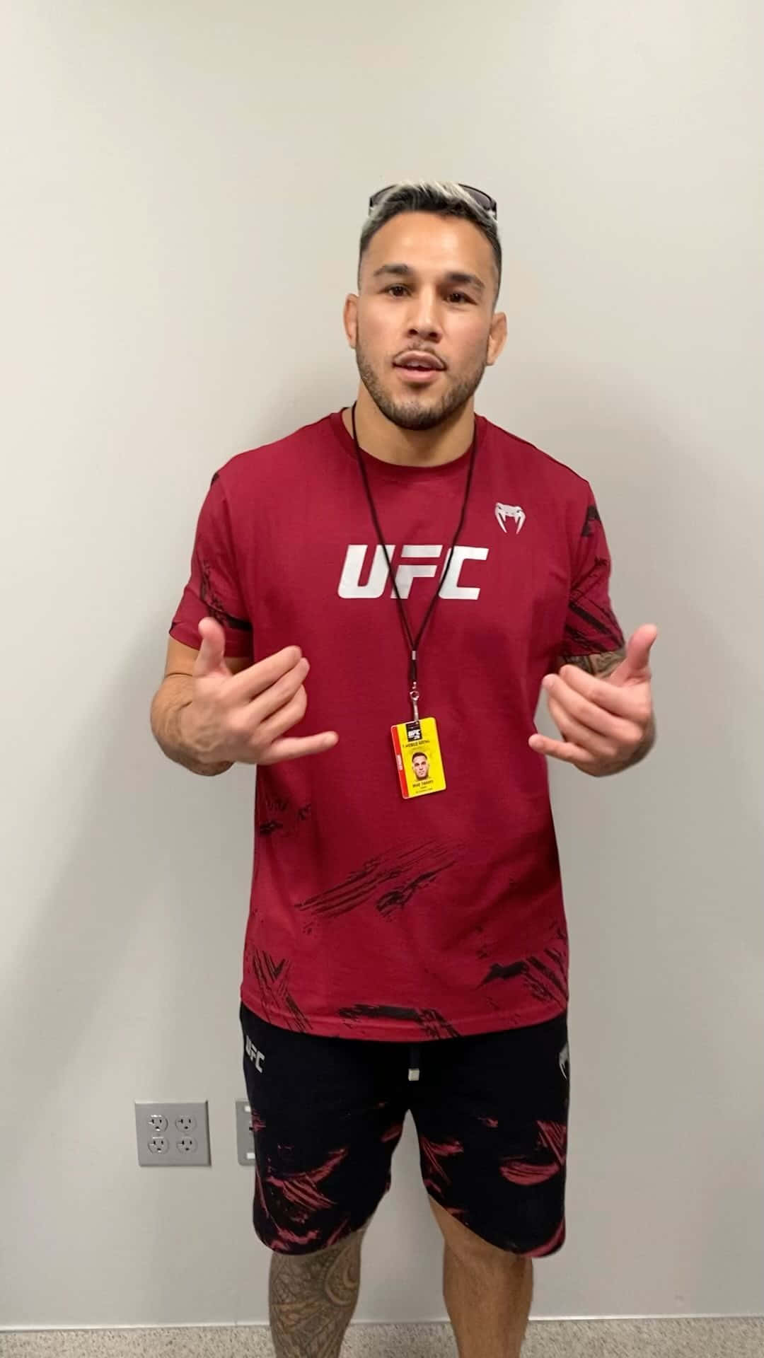 Brad Tavares In Red Phone Background