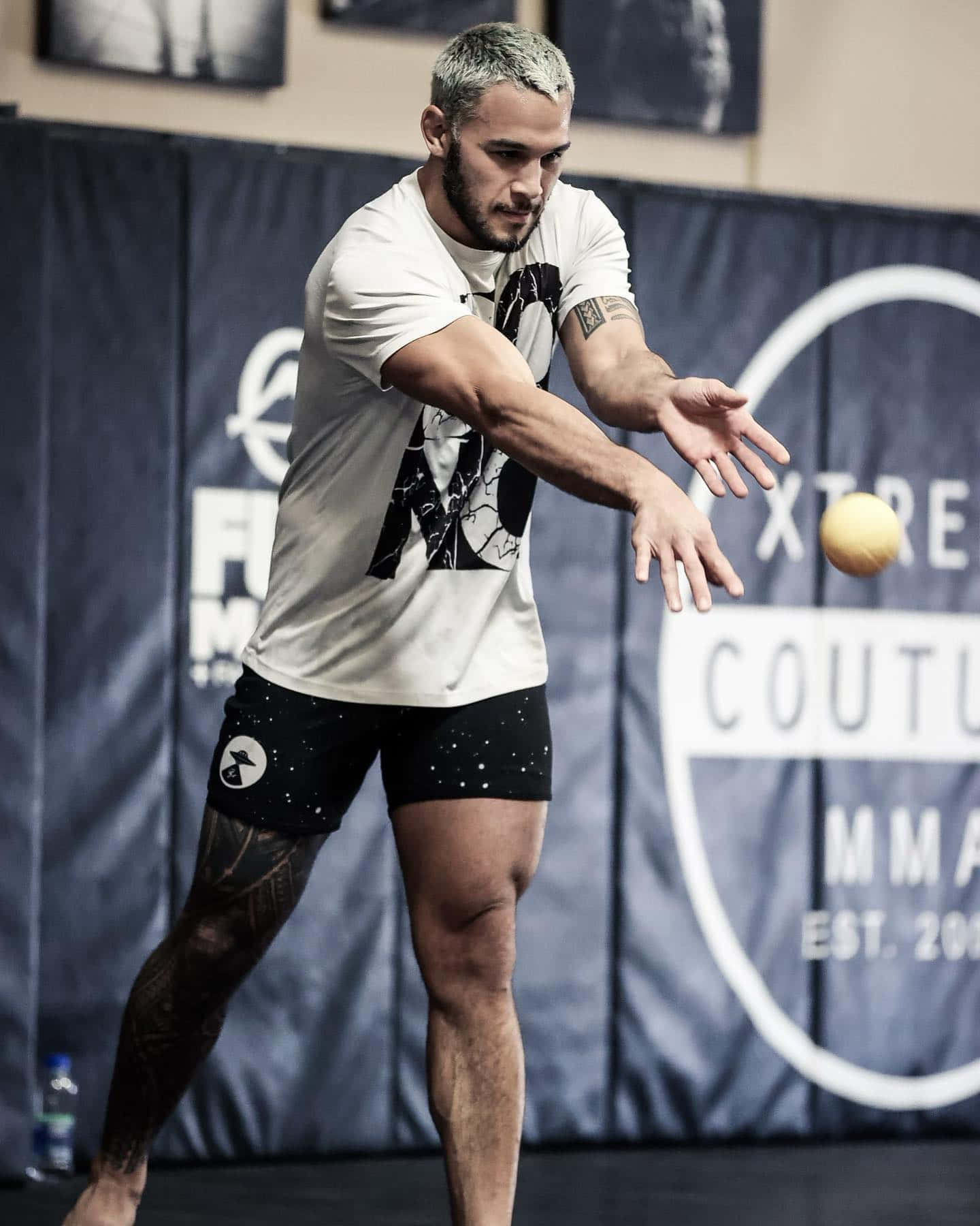 Brad Tavares Throwing A Ball Background