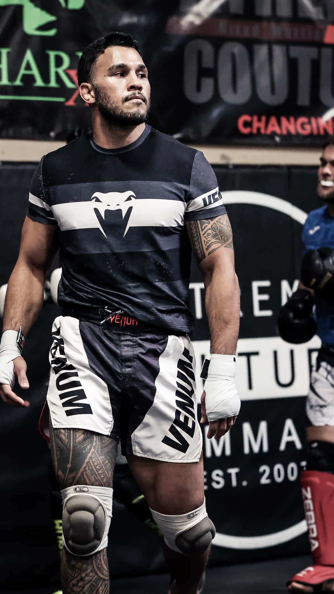 Brad Tavares Wearing Black And White Background