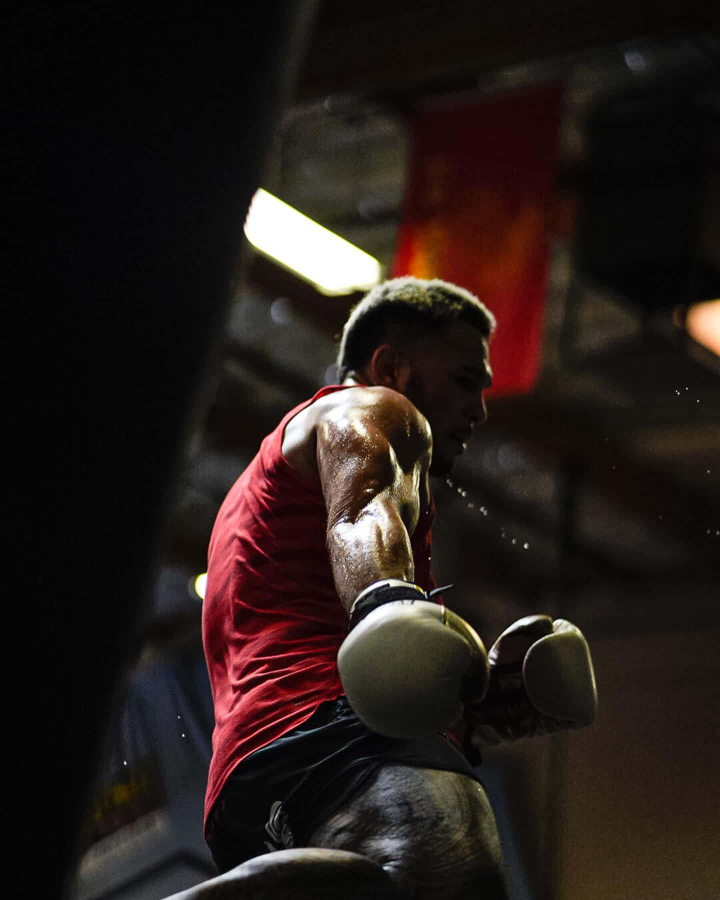 Brad Tavares Wearing Boxing Gloves Background