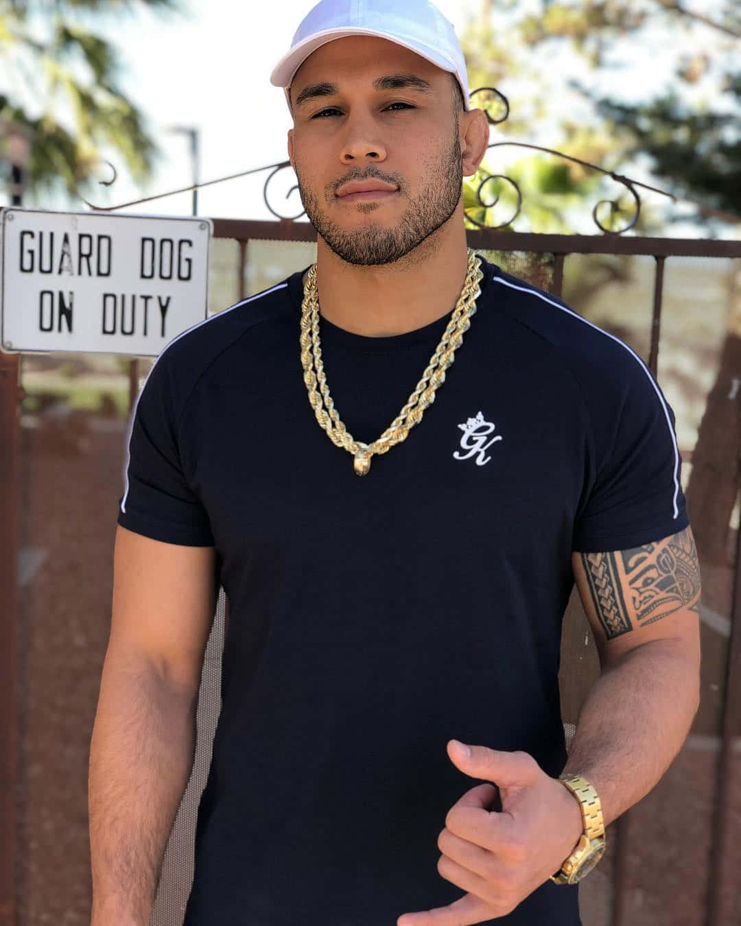 Brad Tavares With A Gold Chain Background