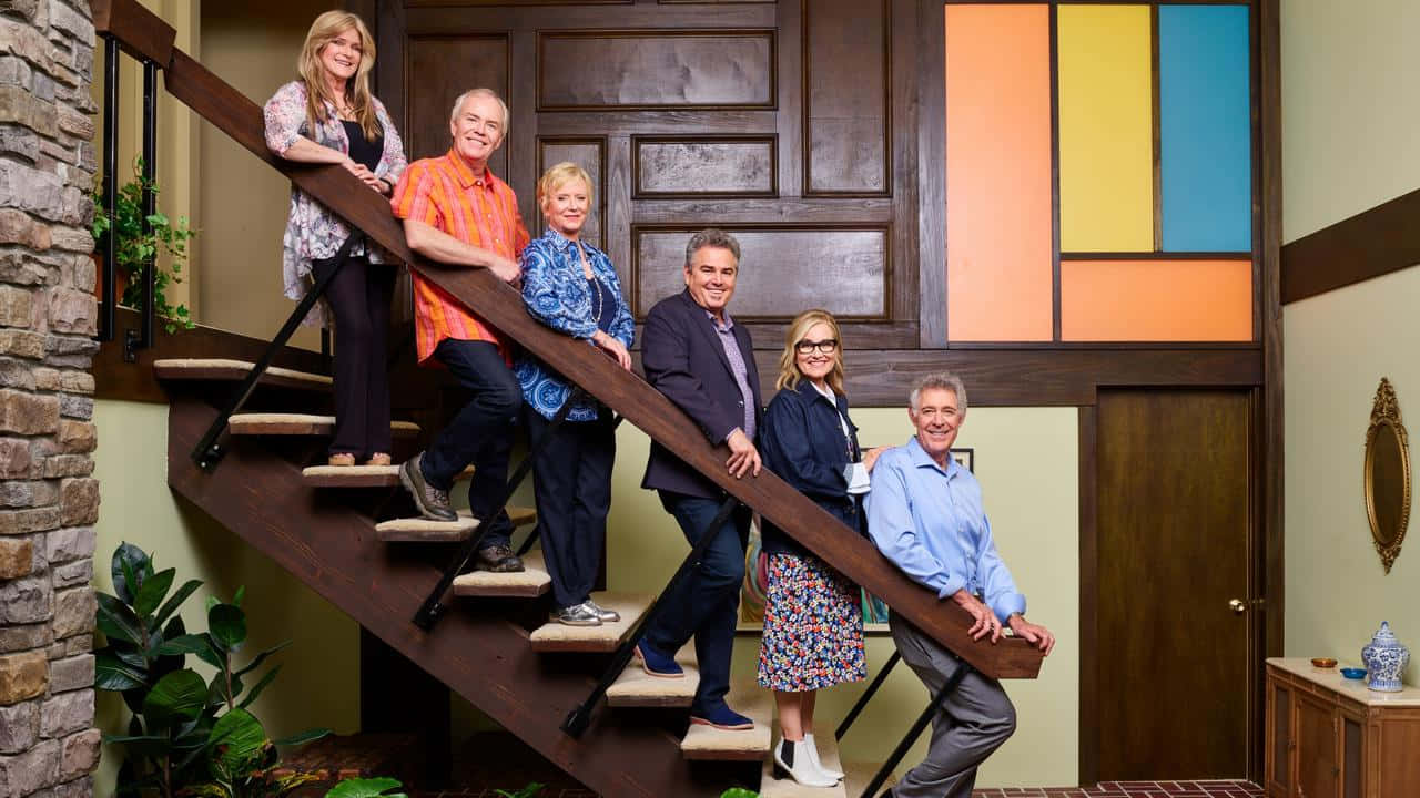 Brady Bunch Family On Stairs Background