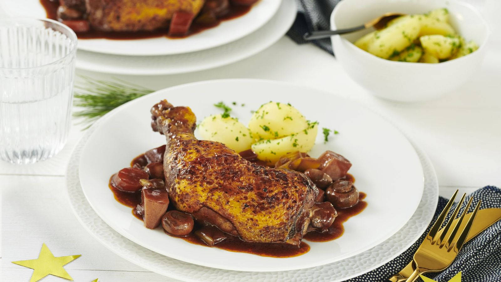 Braised Chicken Coq Au Vin Garnished On A Plate Background