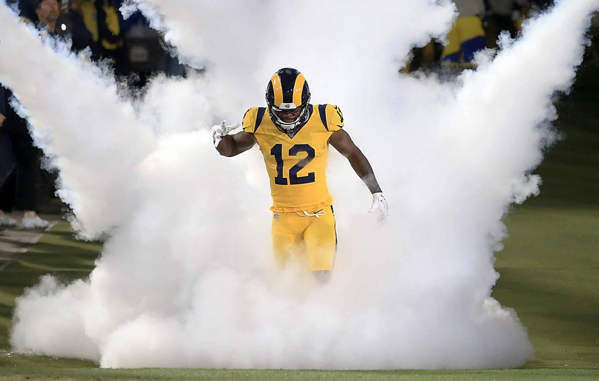 Brandin Cooks Surrounded By Smoke Background